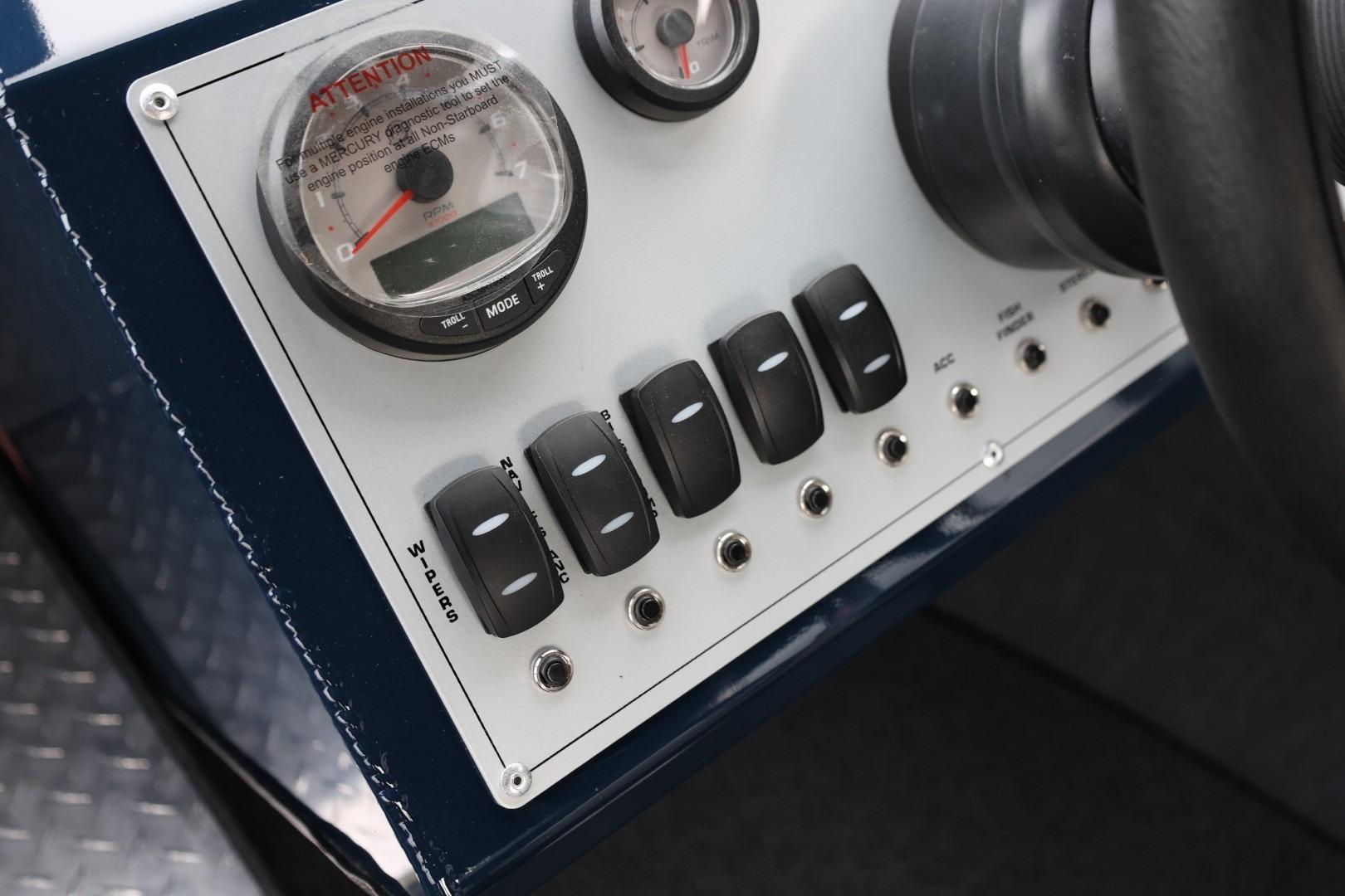 Control panel of 2026 Thunder Jet 24 Alexis Pro boat with switches and gauges.