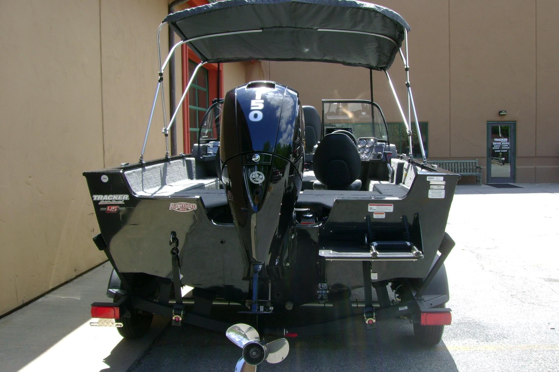 2023 Tracker Pro Guide V-175 WT boat with 150 HP engine, rear view.