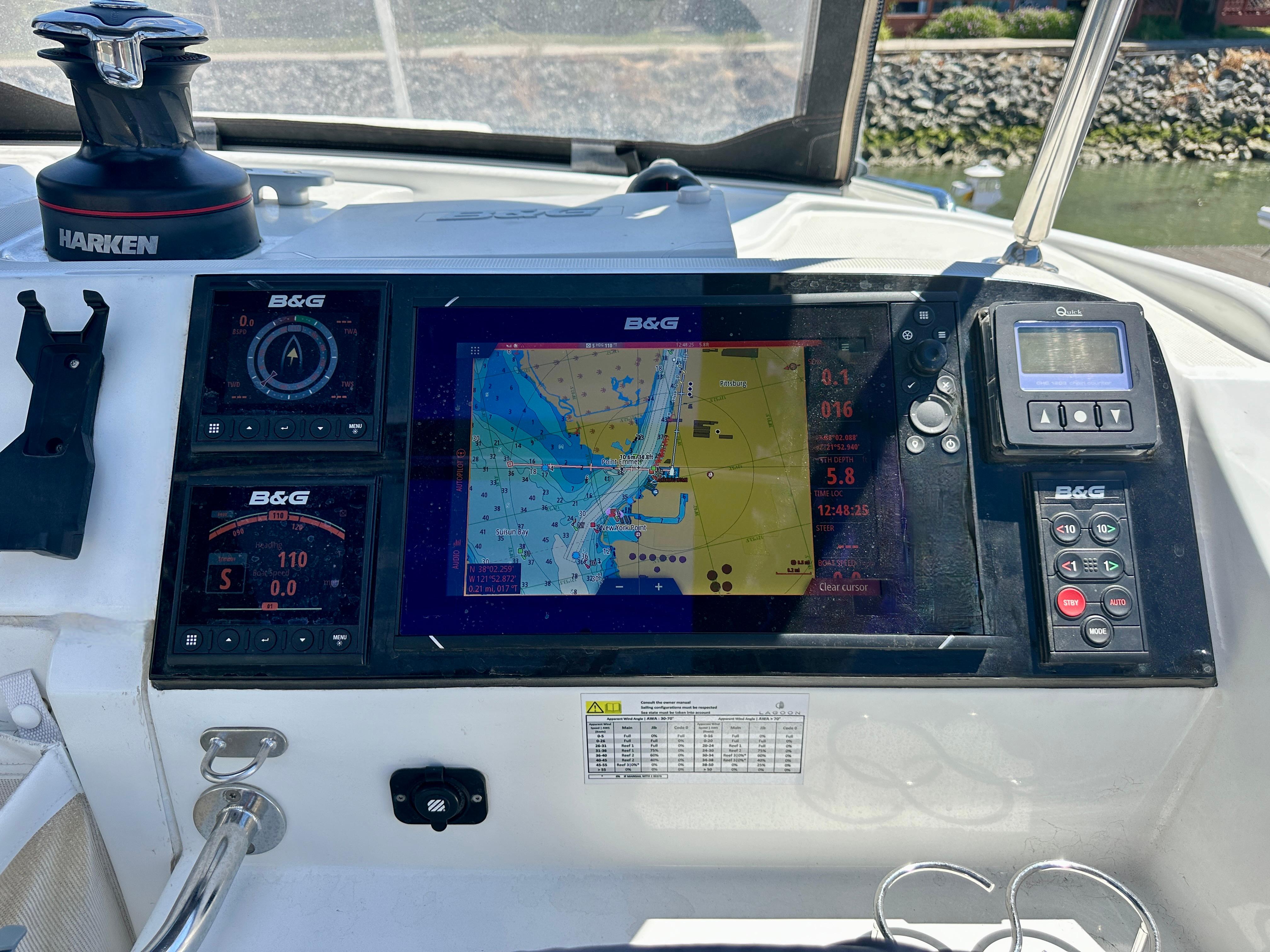 Helm of 2020 Lagoon 40 catamaran with navigation display and controls.