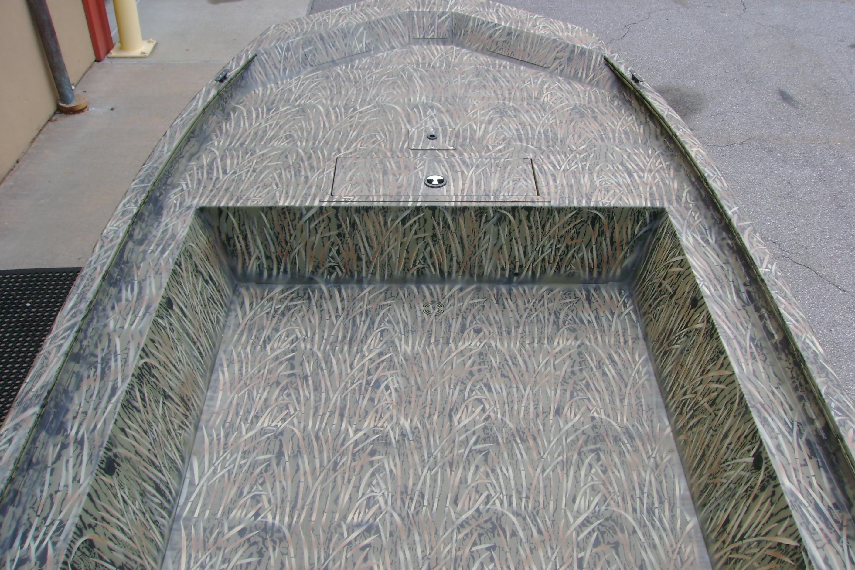2026 Tracker Grizzly 1754 Utility boat with camouflage interior design.