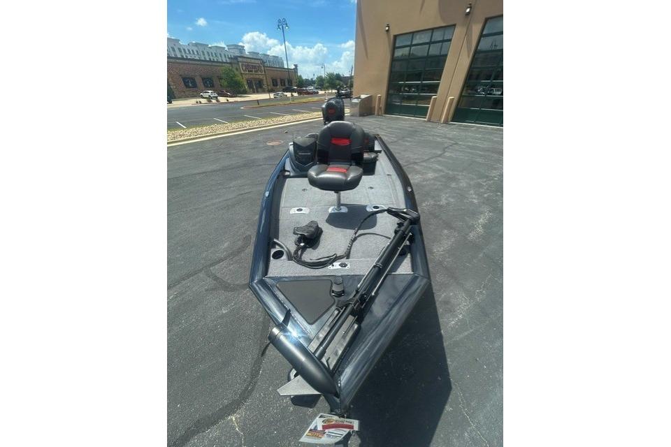 2026 Tracker Pro Team 175 Crappie Edition boat parked outdoors, showcasing sleek design.