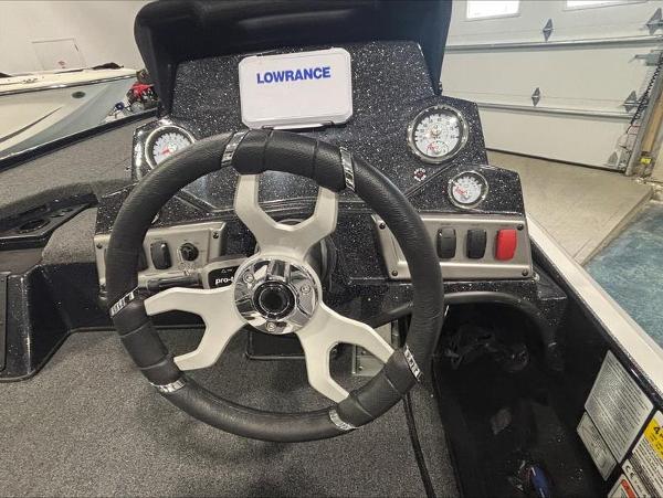 Steering wheel and dashboard of a 2025 Nitro Z18 boat with Lowrance display.