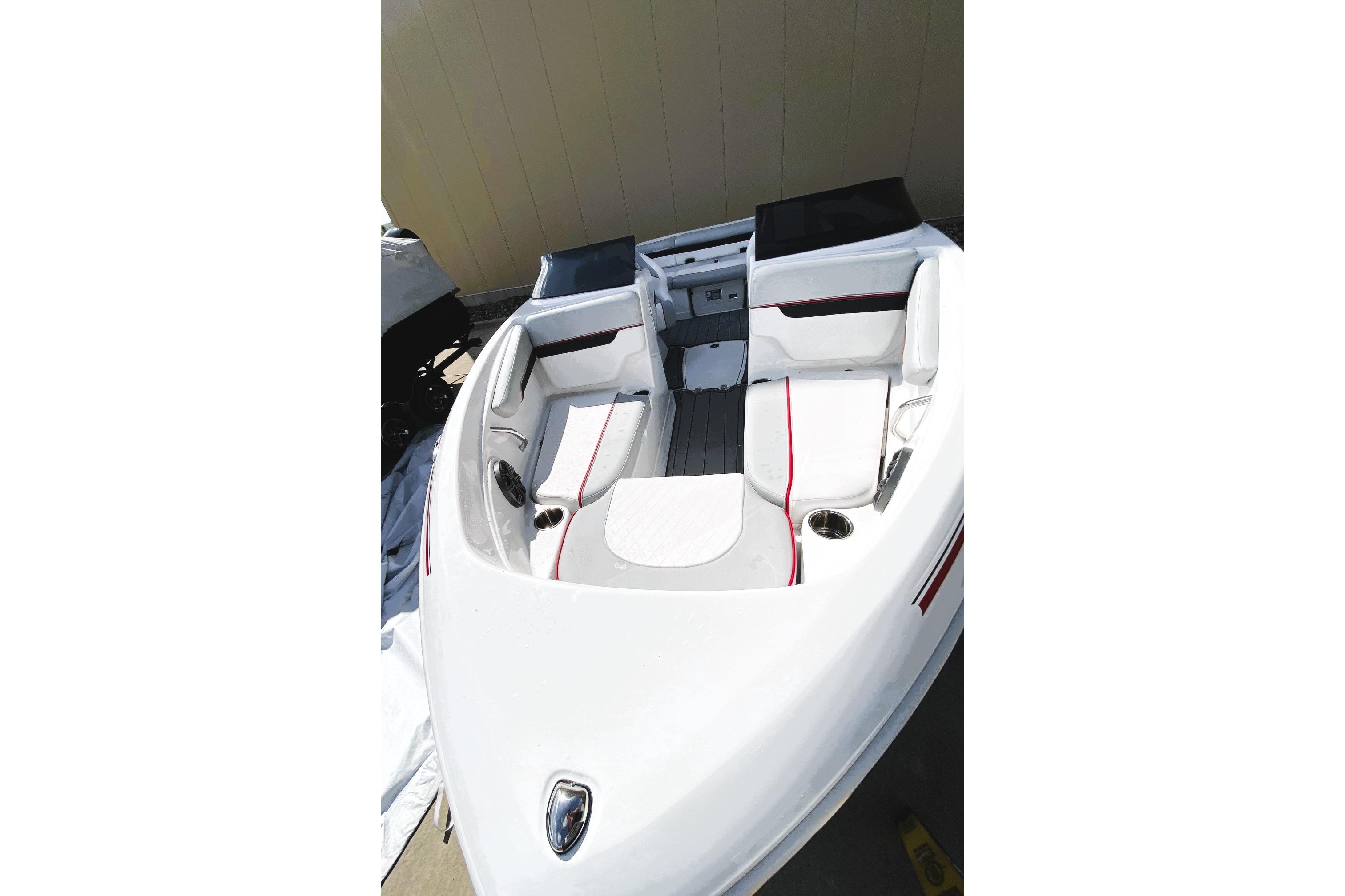 2023 Tahoe 210 Si Limited boat interior with white and red seating.