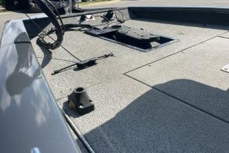 2019 Tracker Pro Team 190 TX boat deck with storage compartments and fishing rod holders.