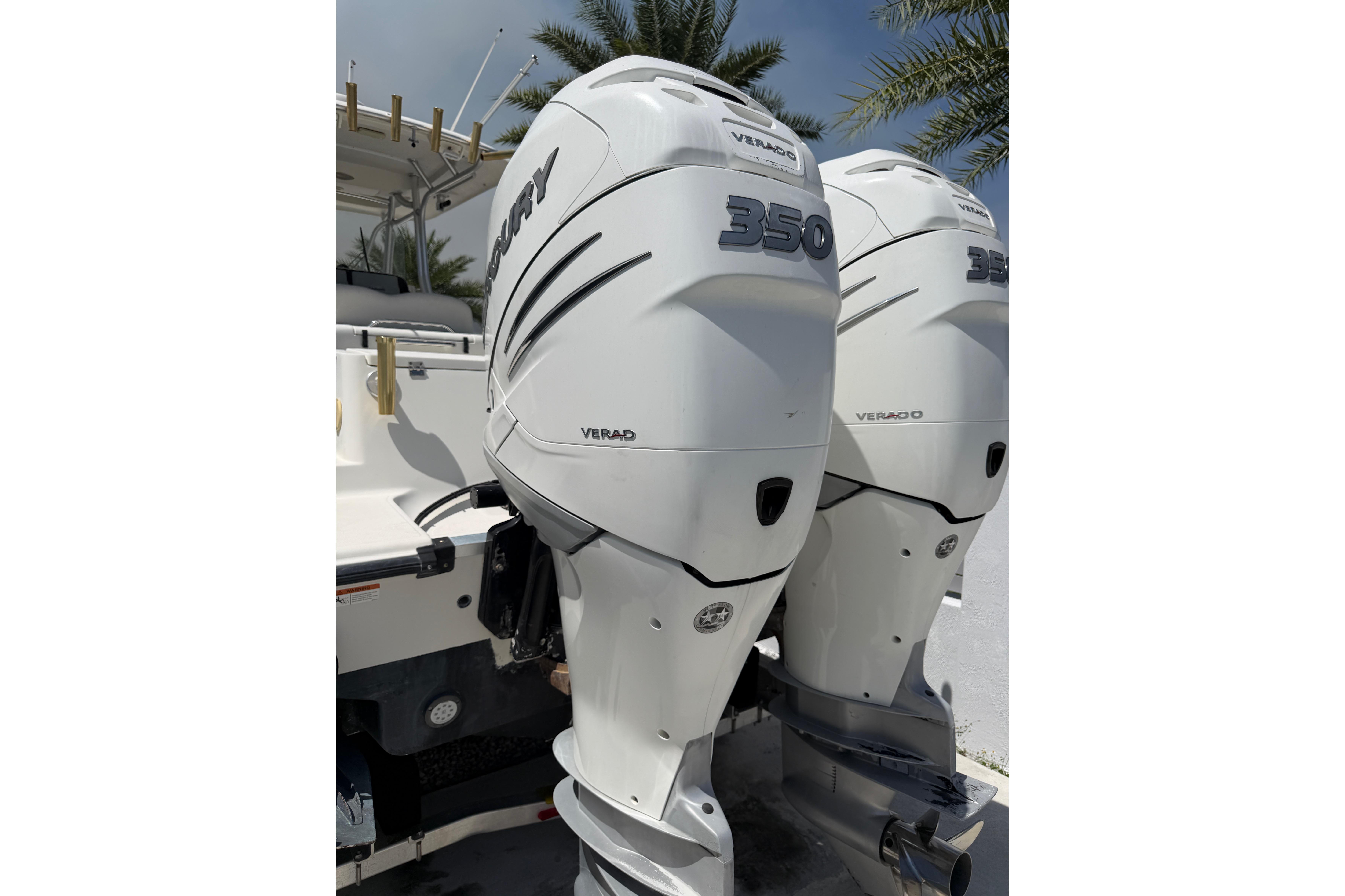2008 Hydra-Sports Vector 2900 CC with twin Mercury Verado 350 engines, docked under palm trees.