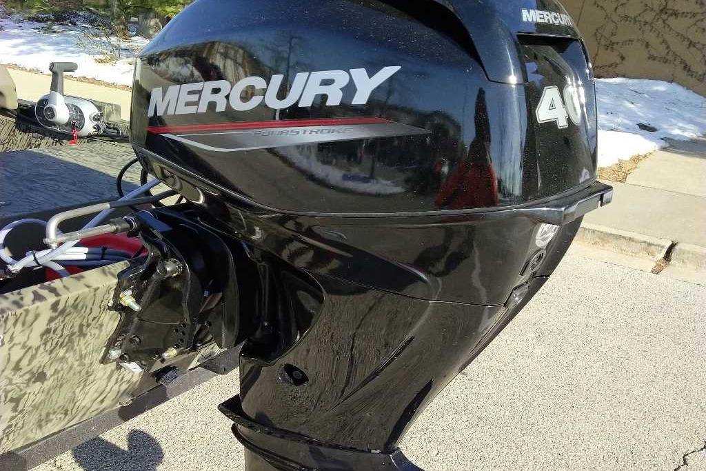 2026 Tracker Grizzly 1648 SC with Mercury 40 outboard motor in snowy setting.