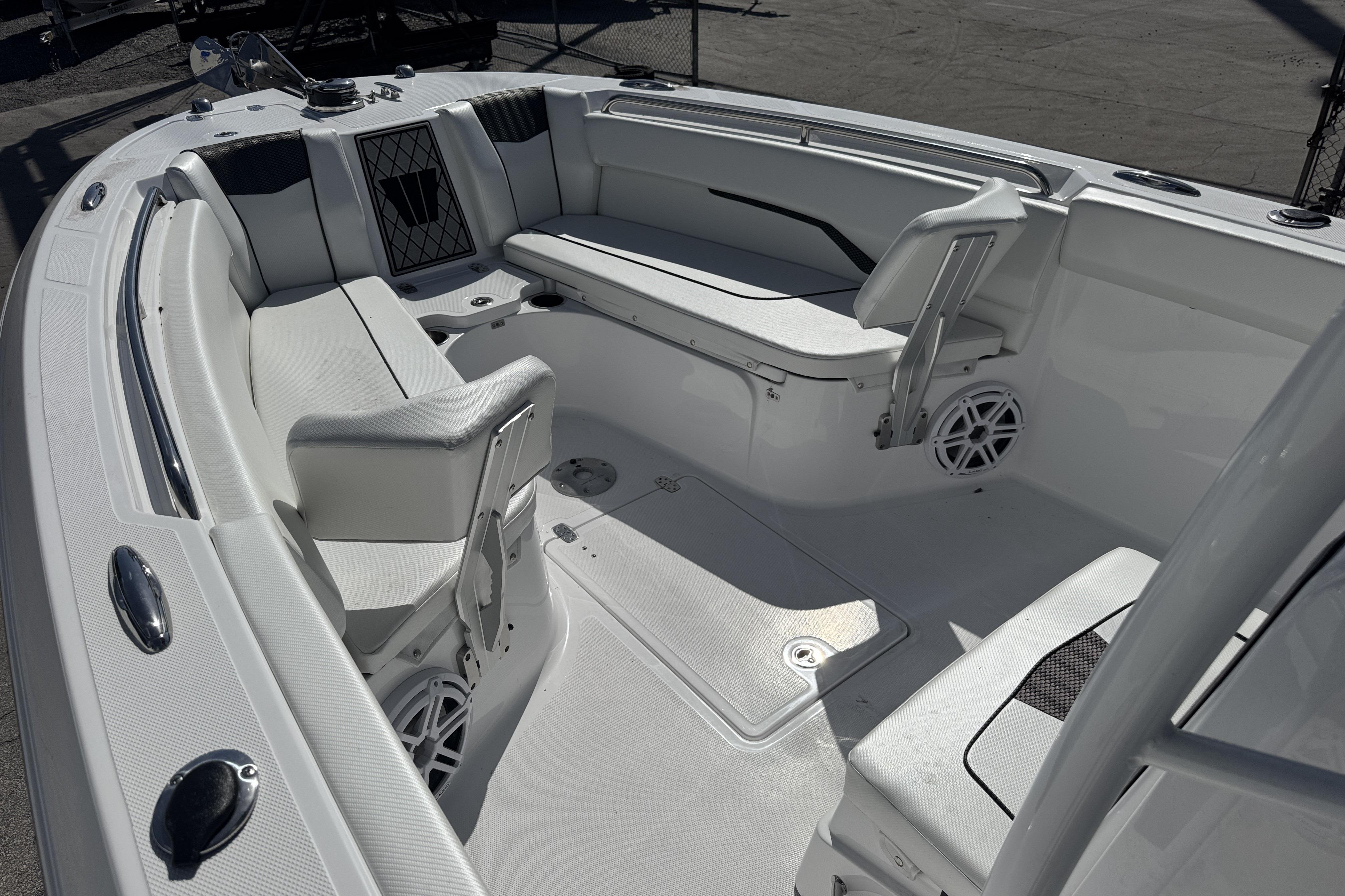 2025 Wellcraft 242 Fisherman boat interior with seating and storage compartments.