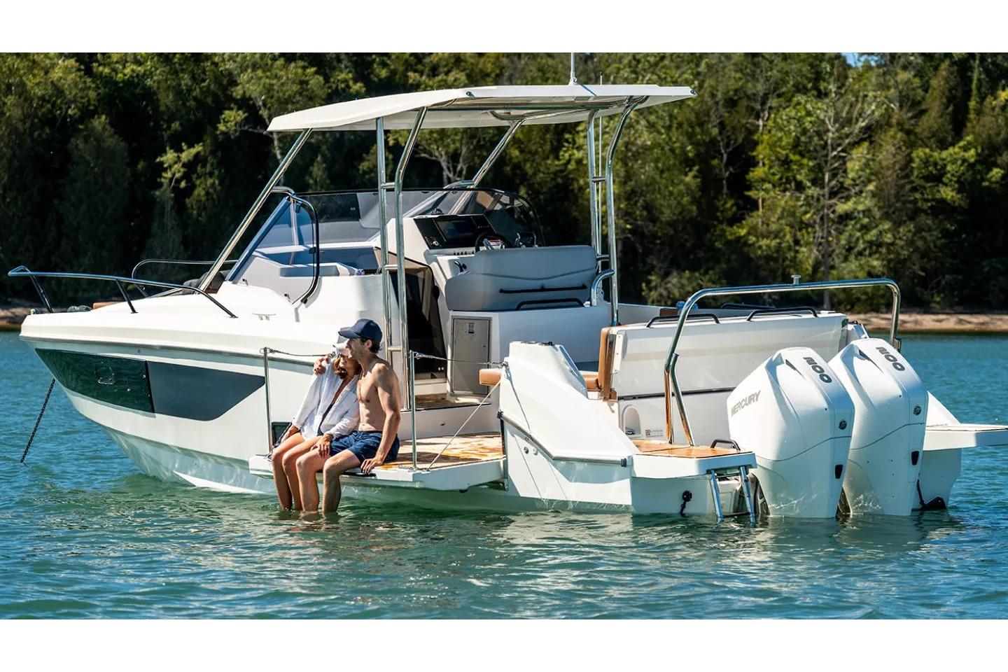 Beneteau Flyer 9 SUNdeck 2026 on calm water with two people.