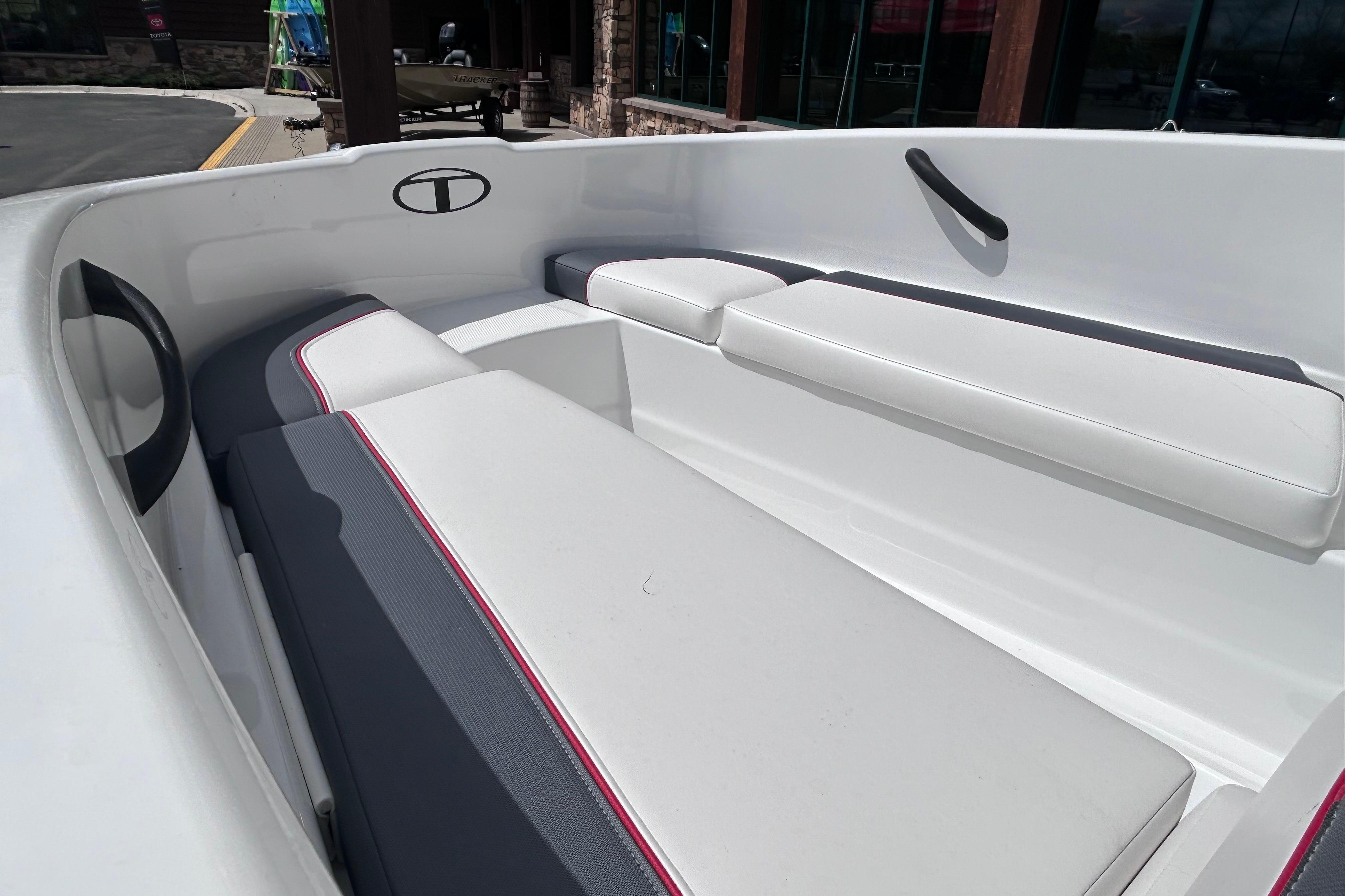 2026 Tahoe T16 boat interior with white and gray cushioned seating.