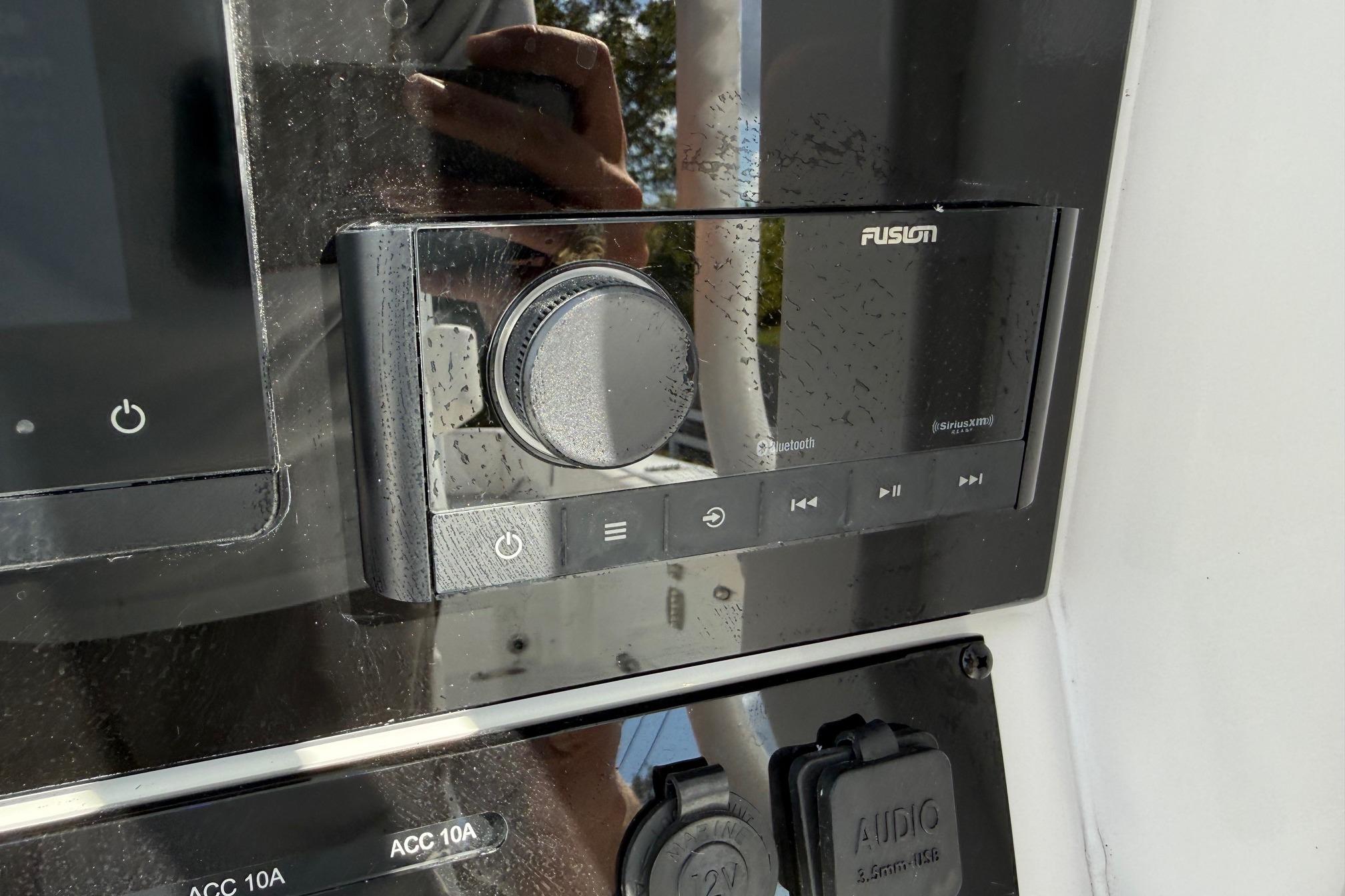 Fusion audio system on 2026 Sea Hunt Ultra 285 Coffin Box boat dashboard.
