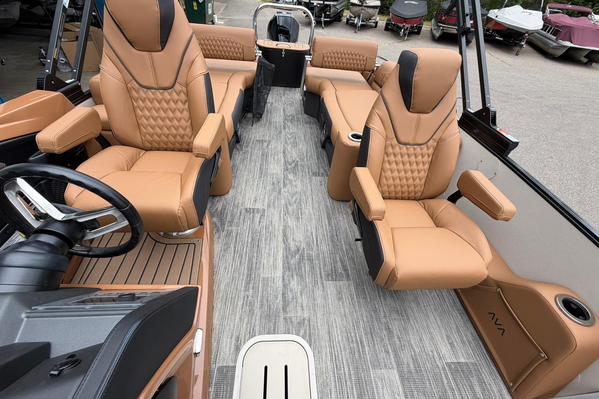 Luxurious interior of 2026 Avalon Catalina Quad Lounge Shift boat with tan leather seating.
