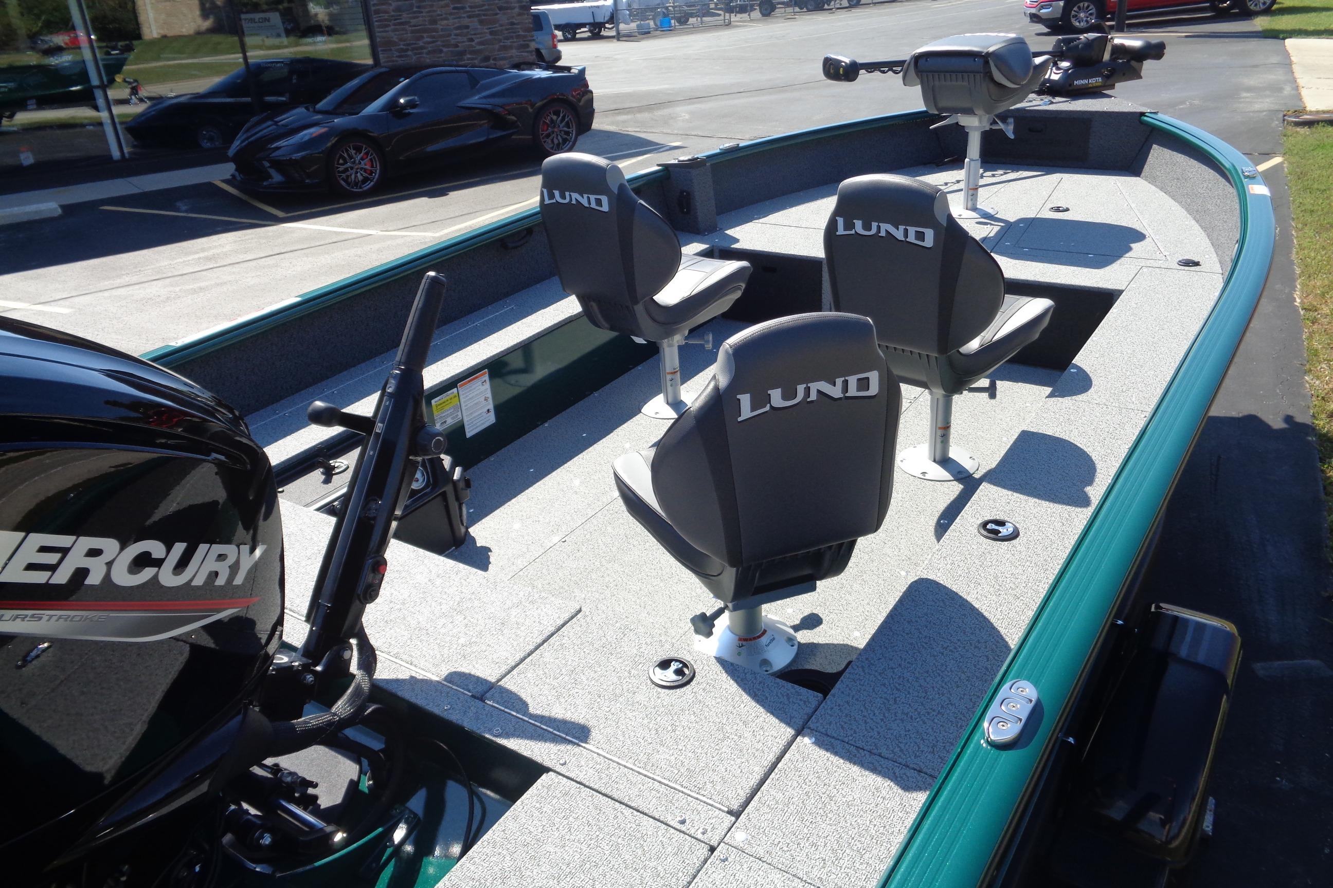 2026 Lund 1800 Explorer Tiller boat with Mercury engine and three seats.