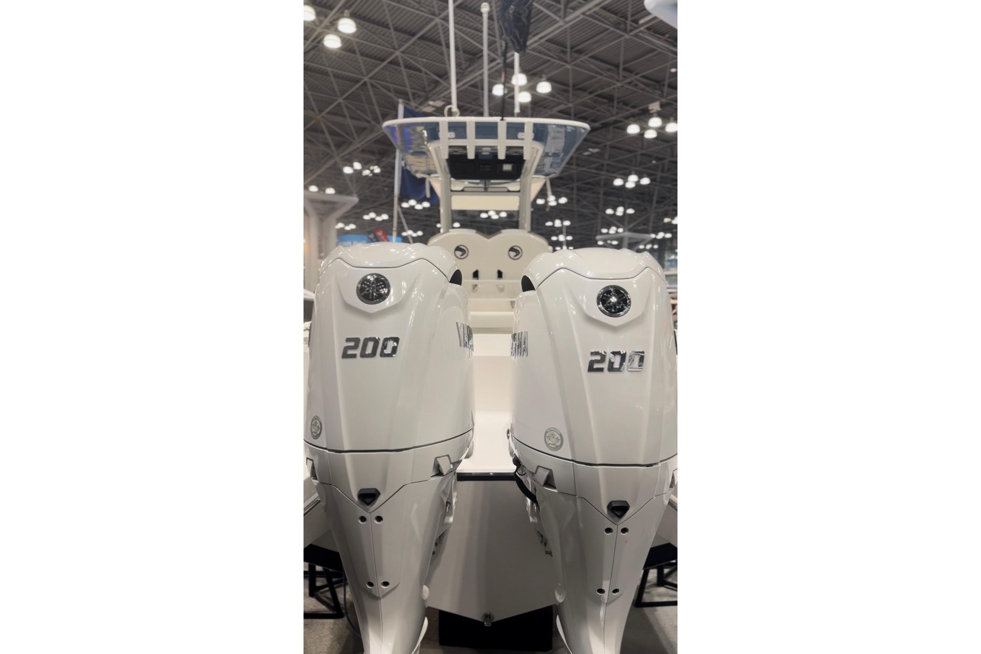 Two Yamaha 200 outboard motors on an Edgewater 250CC boat, year 2026.