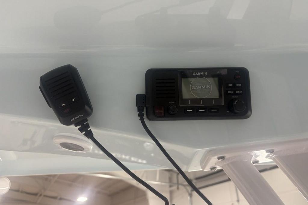 Garmin marine radio and microphone on 2026 Sportsman Masters 227 boat.