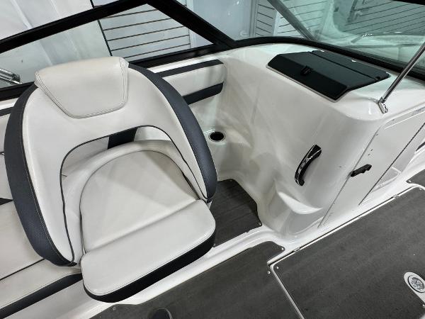 2014 Yamaha Boats 212X interior with white and black seating, sleek design, and modern dashboard.