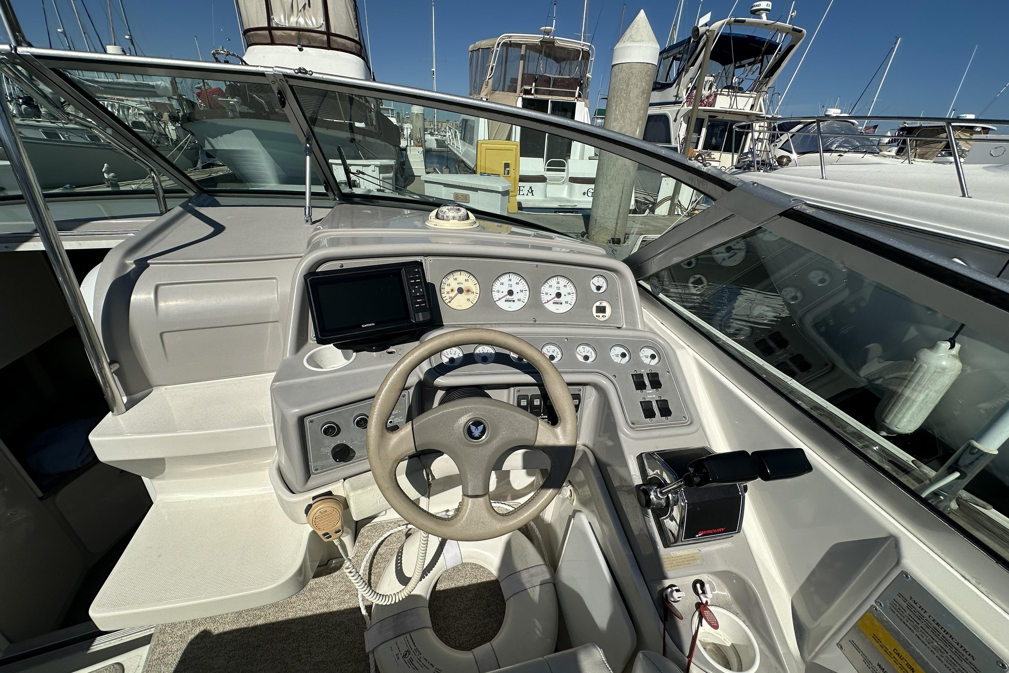 Cockpit of 2000 Formula 280 Sun Sport boat with steering wheel and control panel.