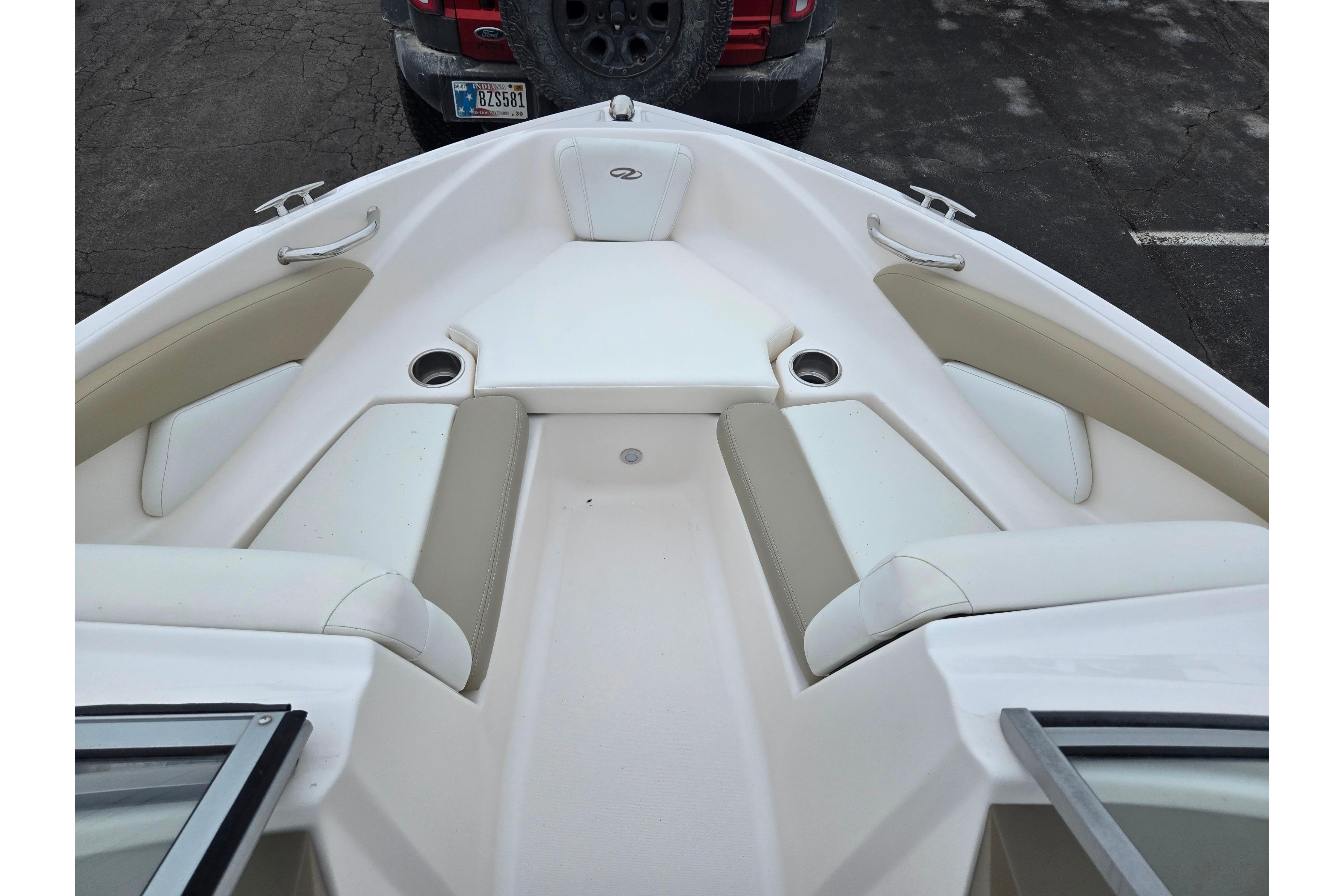 2015 Regal 1900 ES Bowrider boat interior with beige and white seating.