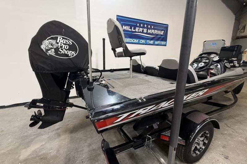 2016 Tracker Pro Team 175 TXW boat with Bass Pro Shops motor cover in showroom.