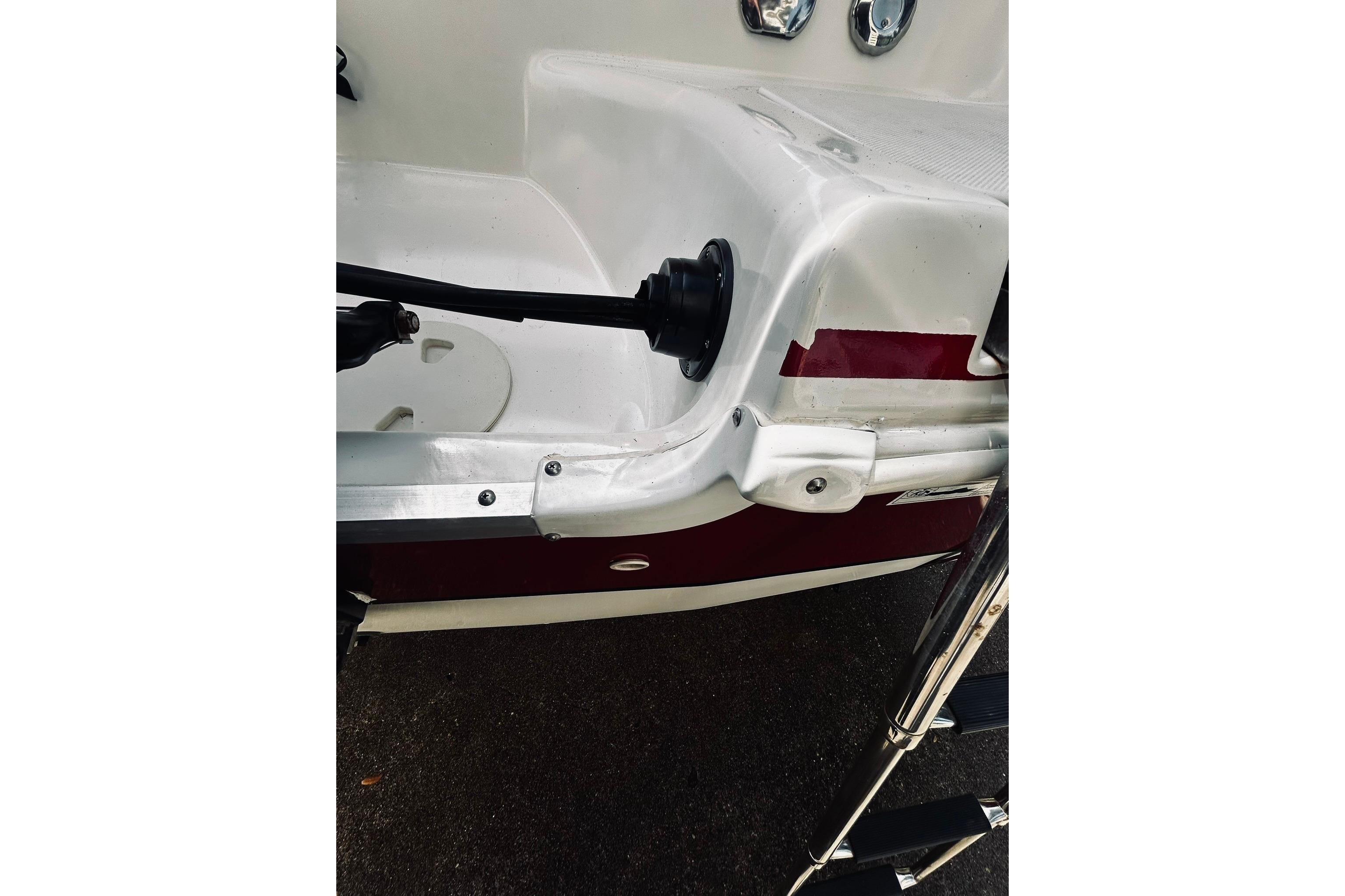 2013 Hurricane SunDeck Sport 201 OB boat, rear view with ladder and engine mount.