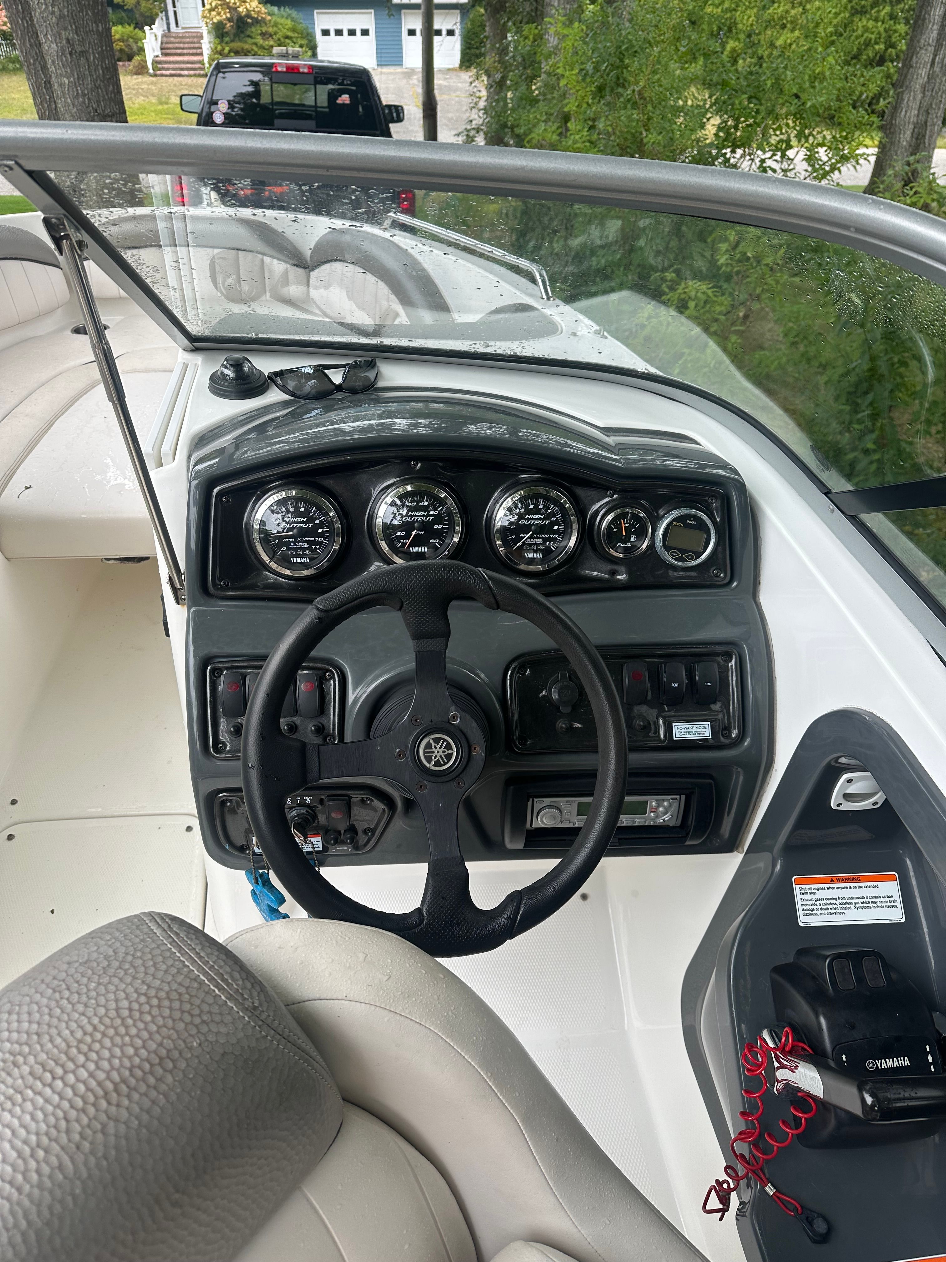 Yamaha SX230 HO 2008 boat dashboard with steering wheel and controls.