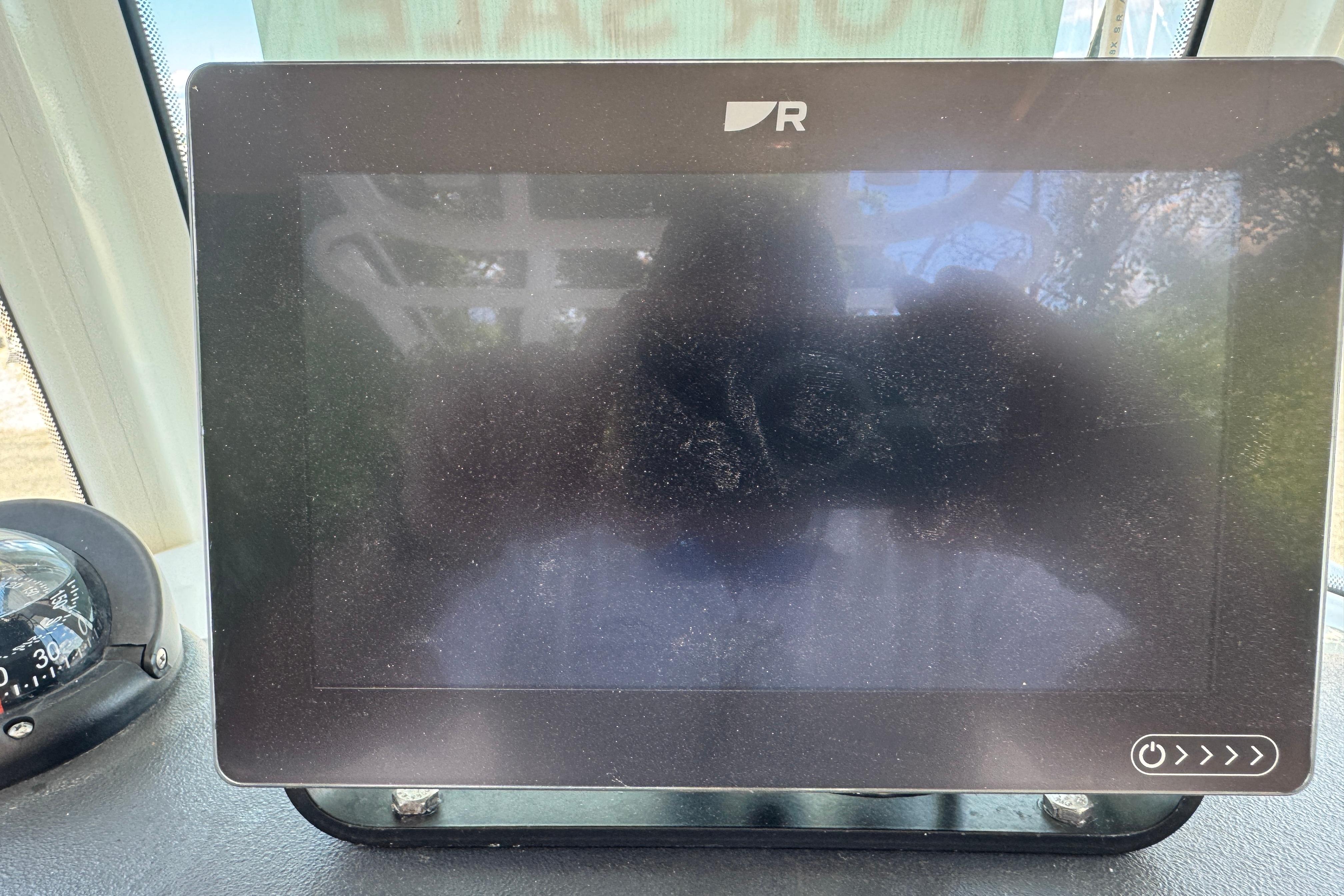 Touchscreen display on a 2014 Boston Whaler 250 Outrage boat dashboard.
