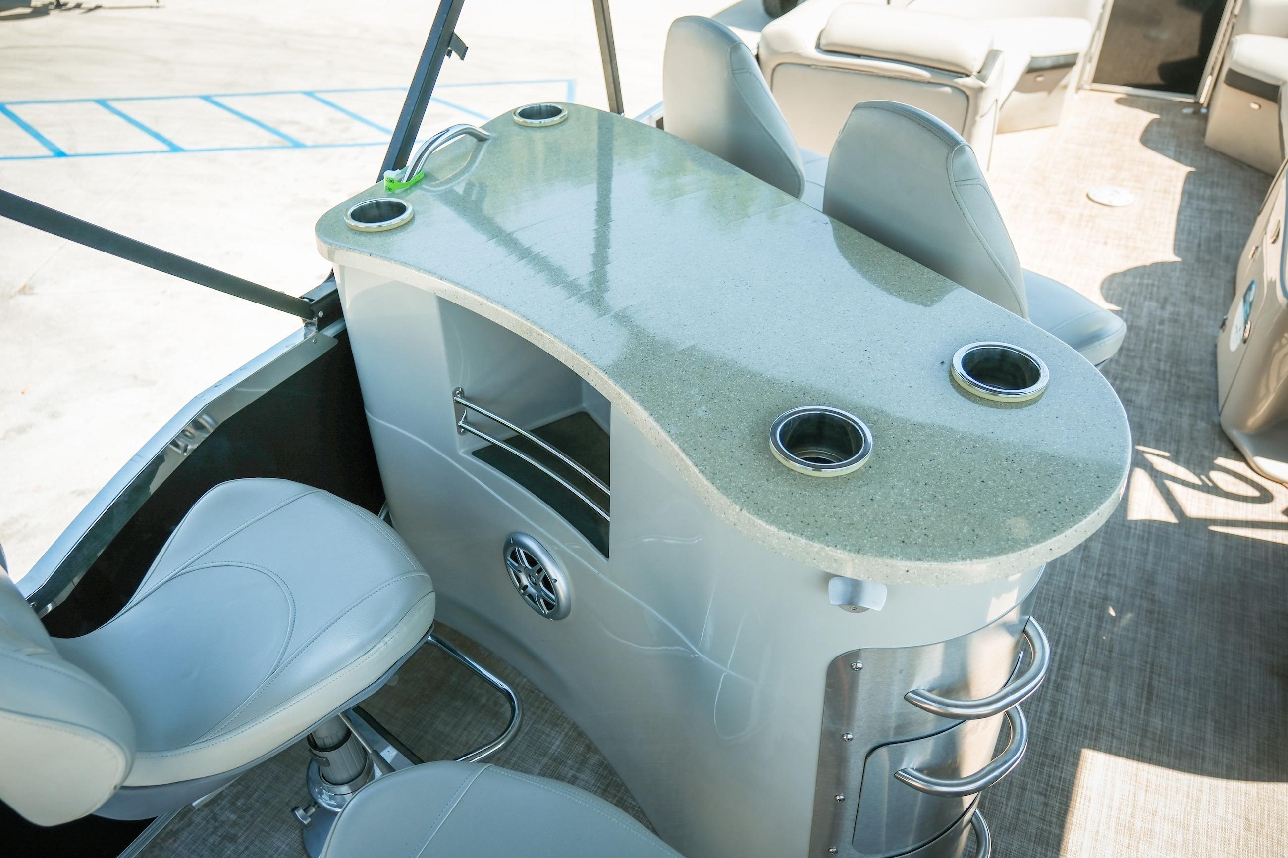 Interior of 2019 Berkshire 25CLE STS pontoon boat with seating and bar area.
