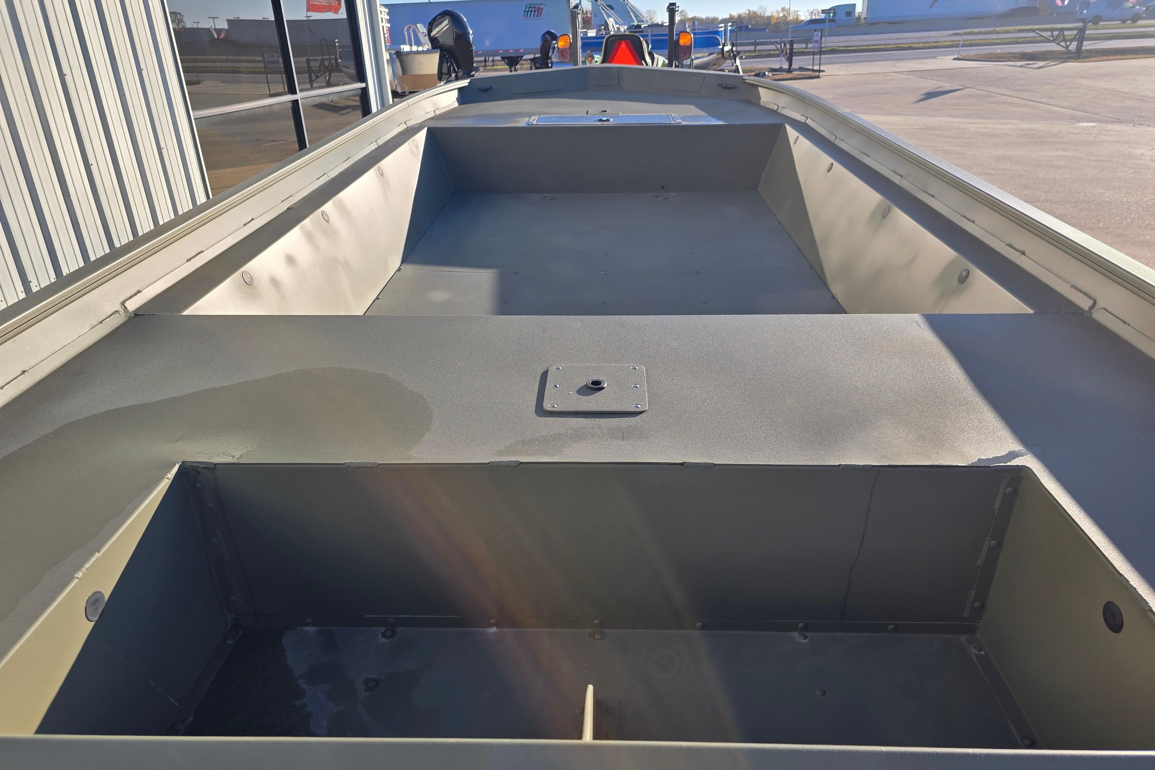 2025 Tracker Grizzly 1860 Utility boat interior view, showcasing spacious deck and storage.