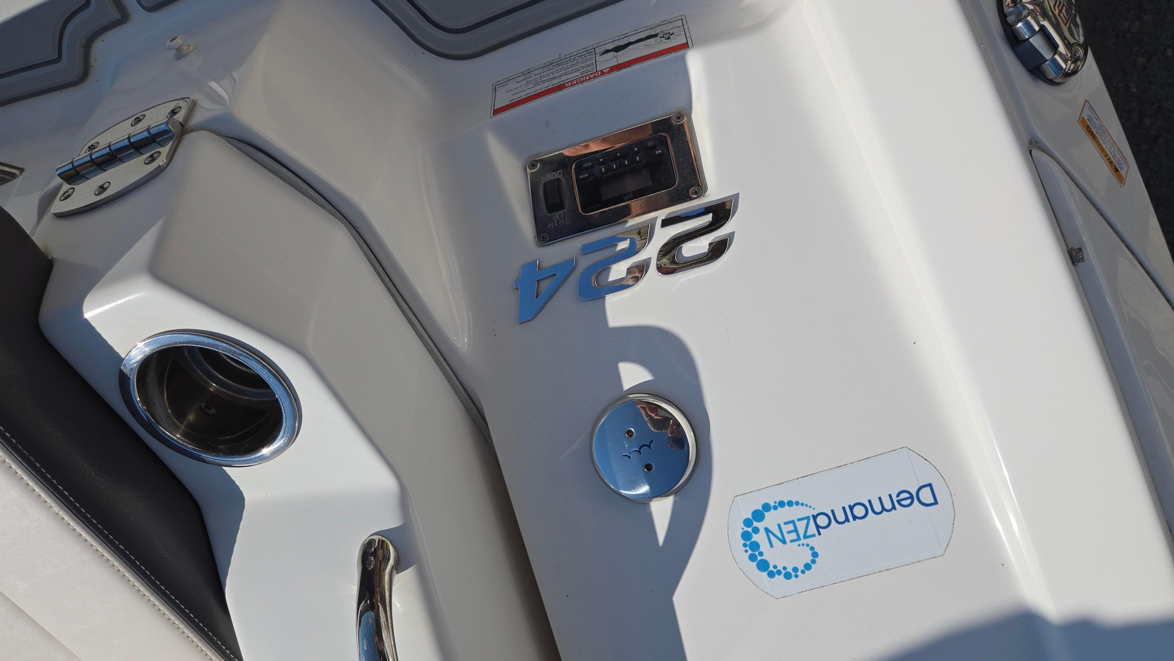2018 Chaparral 224 Sunesta boat deck with cup holder and branding.