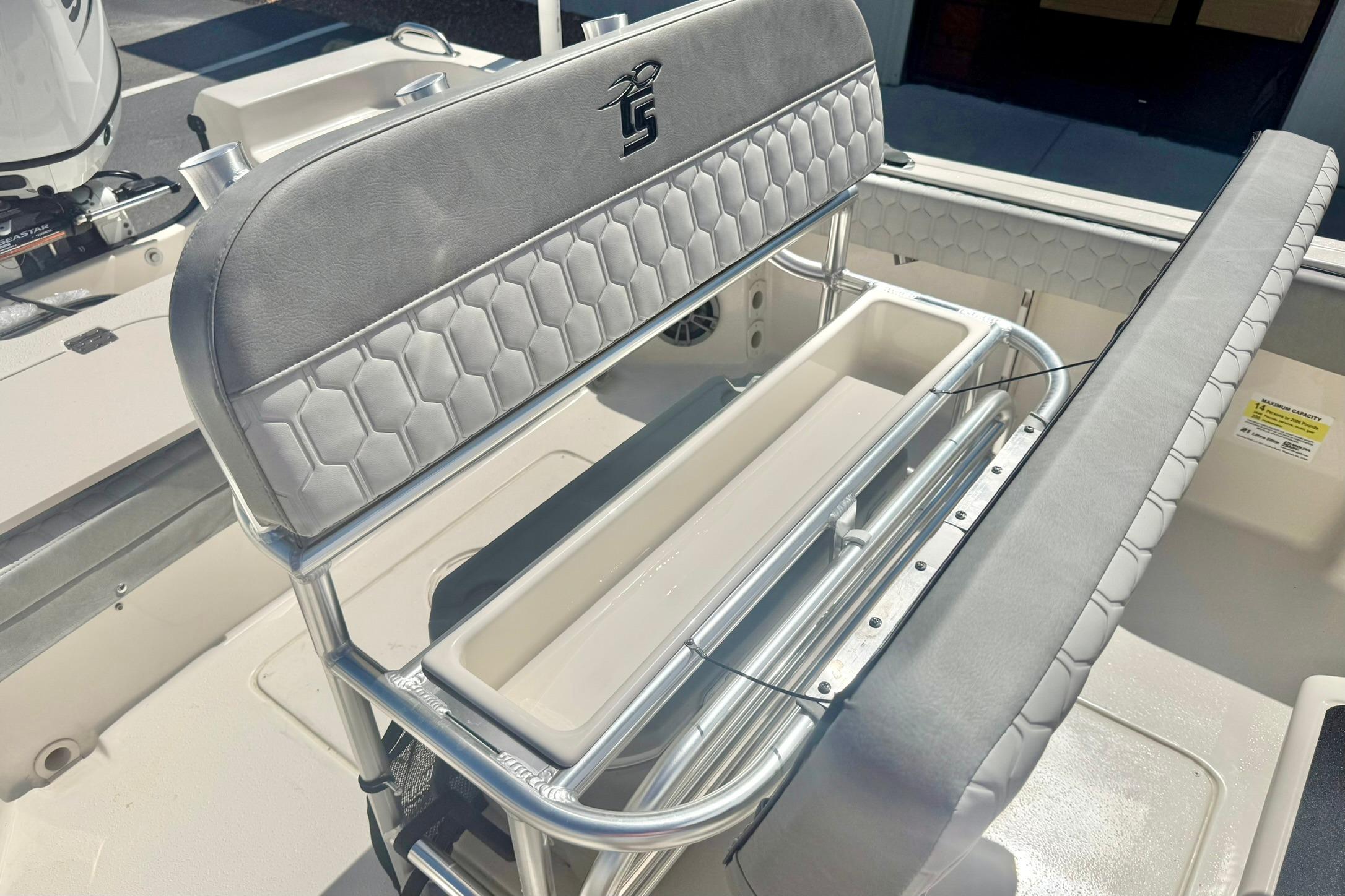 2026 Carolina Skiff 21 Ultra Elite boat seating with storage compartment.