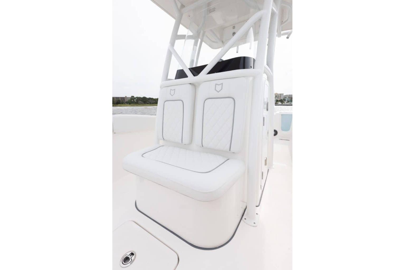 White seating area on 2027 Sea Fox 248 Commander boat, featuring sleek design and comfortable cushions.