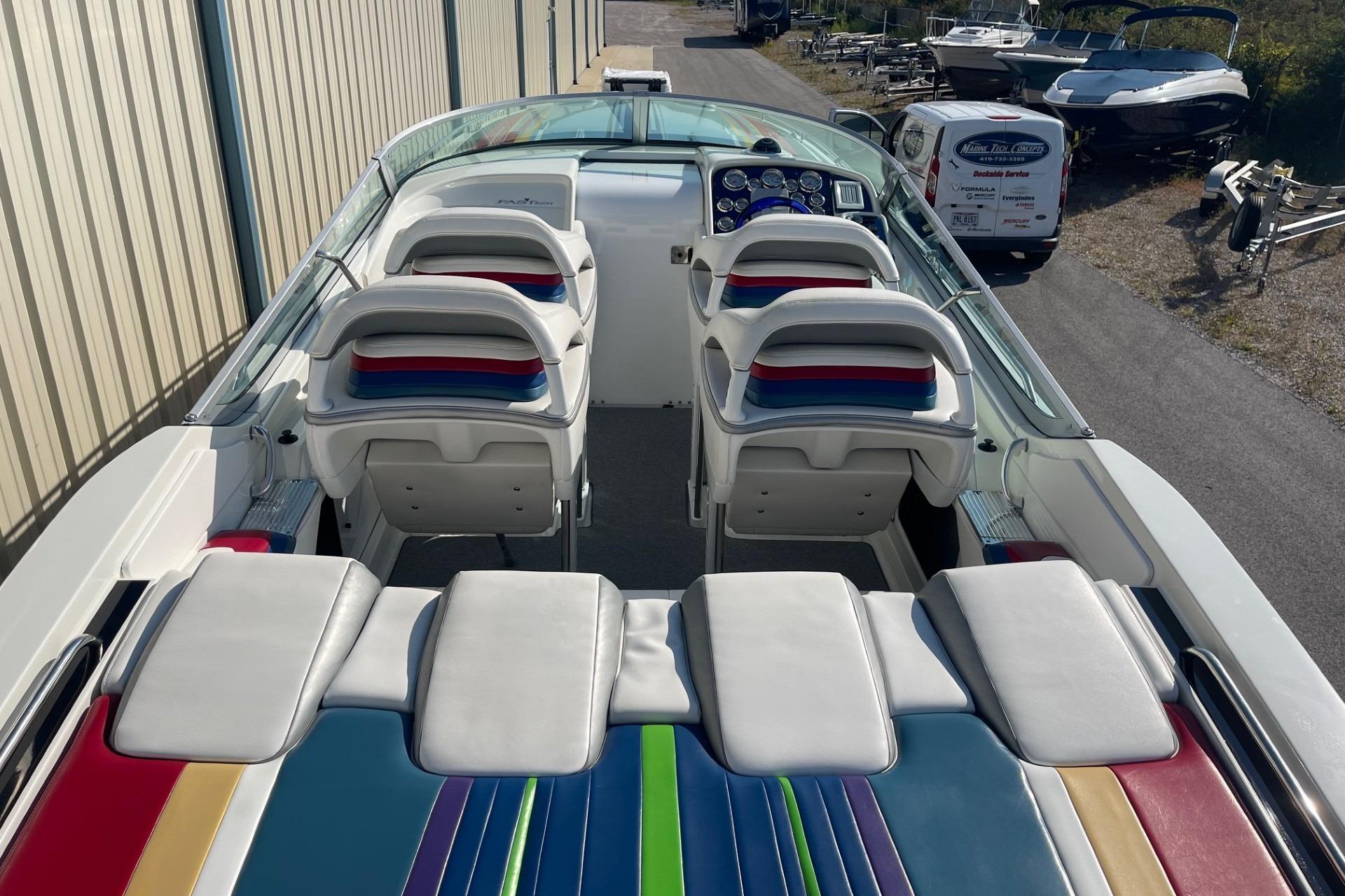 2004 Formula 382 FASTech boat interior with colorful seating and dashboard.