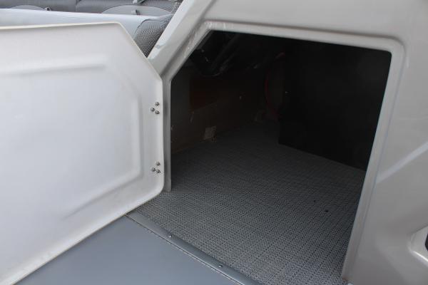 Open storage compartment in 2025 Regency 230 DL3 boat.