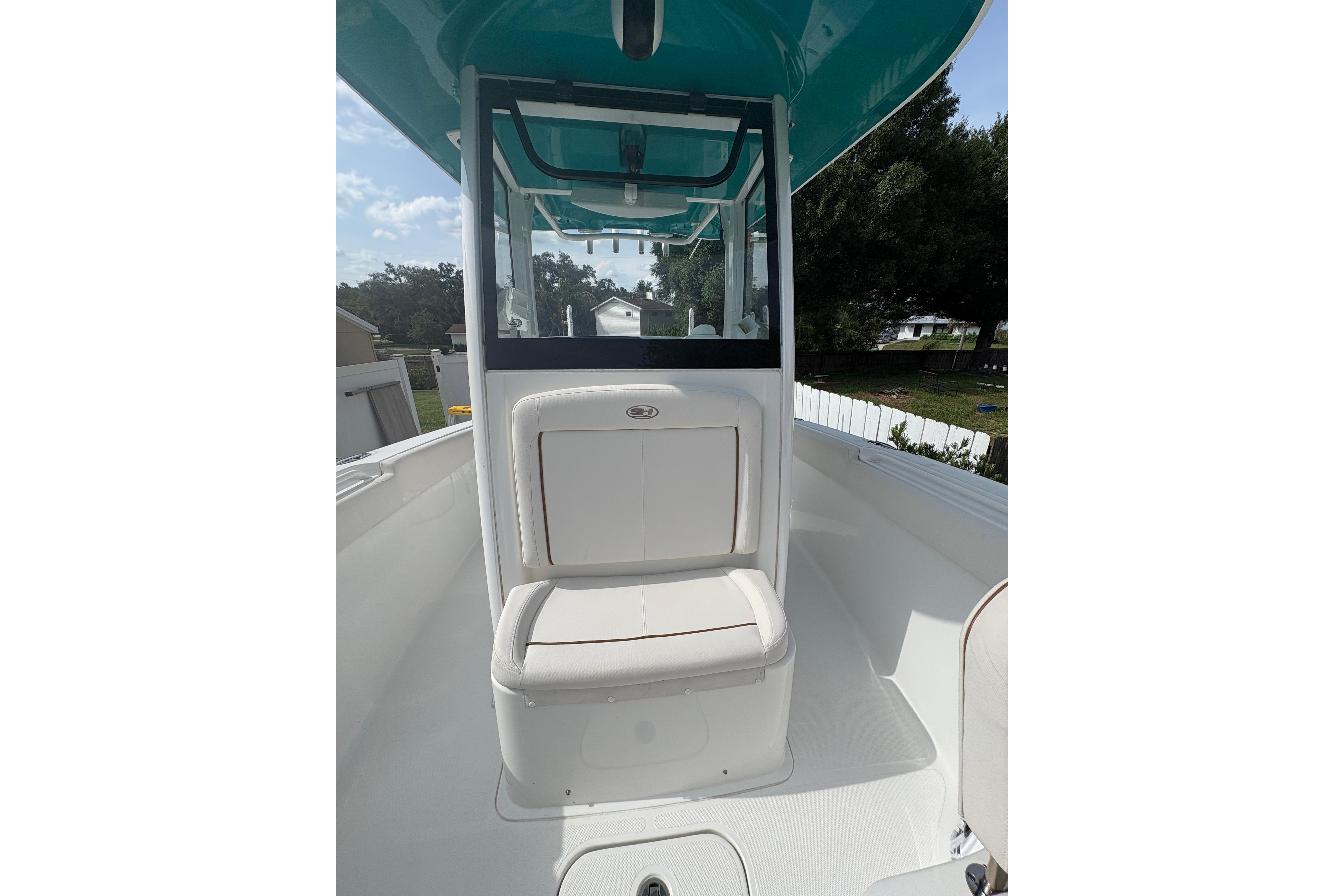 2021 Sea Hunt Ultra 265 SE boat interior with seating and console, showcasing sleek design.