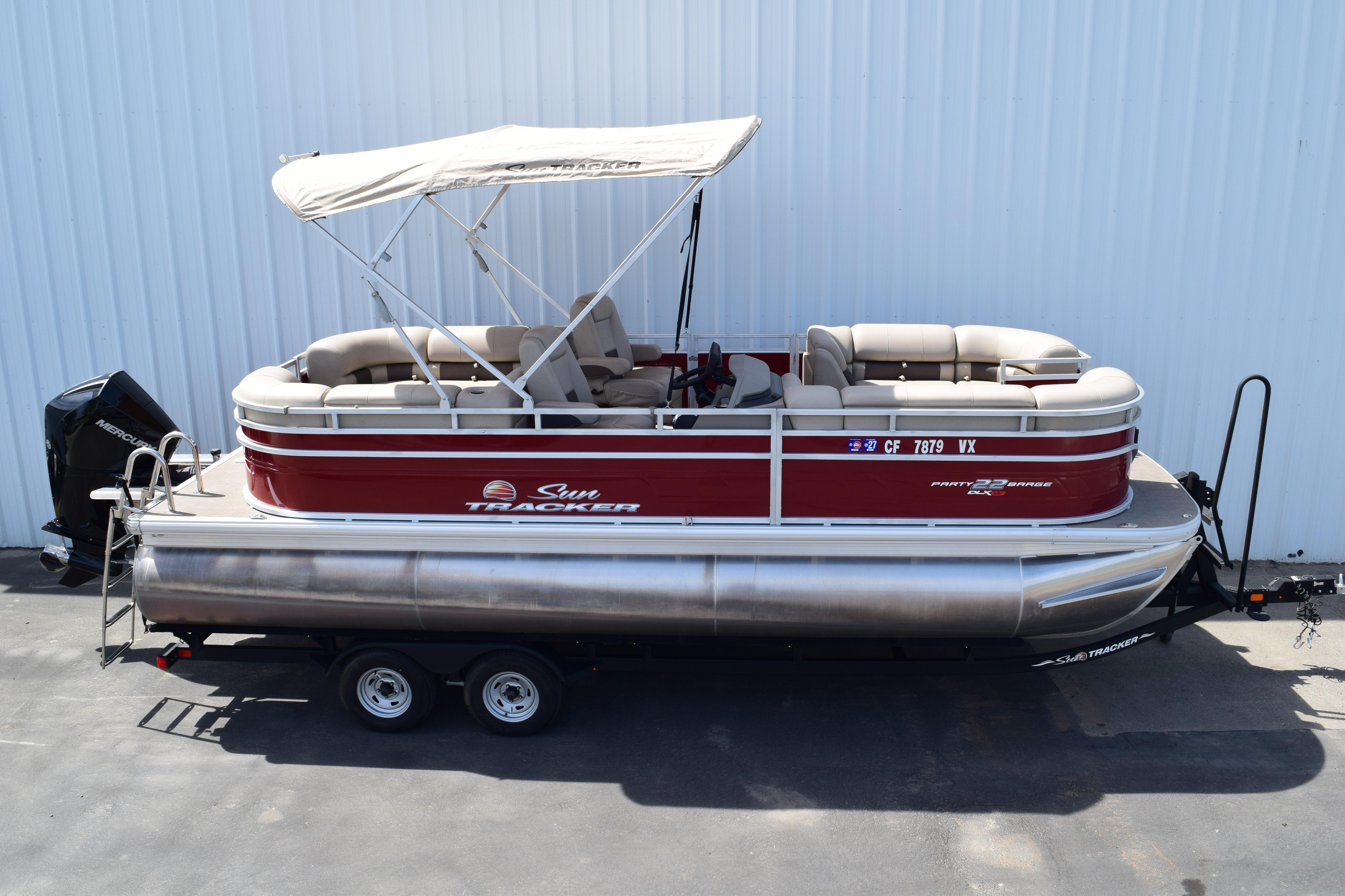 2025 Sun Tracker Party Barge 22 XP3 pontoon boat with canopy and trailer.