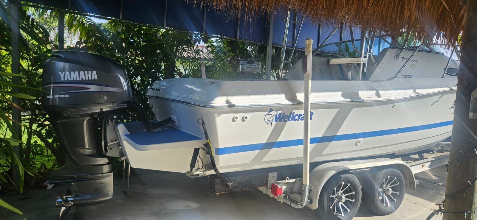 2000 Wellcraft 24 Walkaround boat with Yamaha outboard motor.