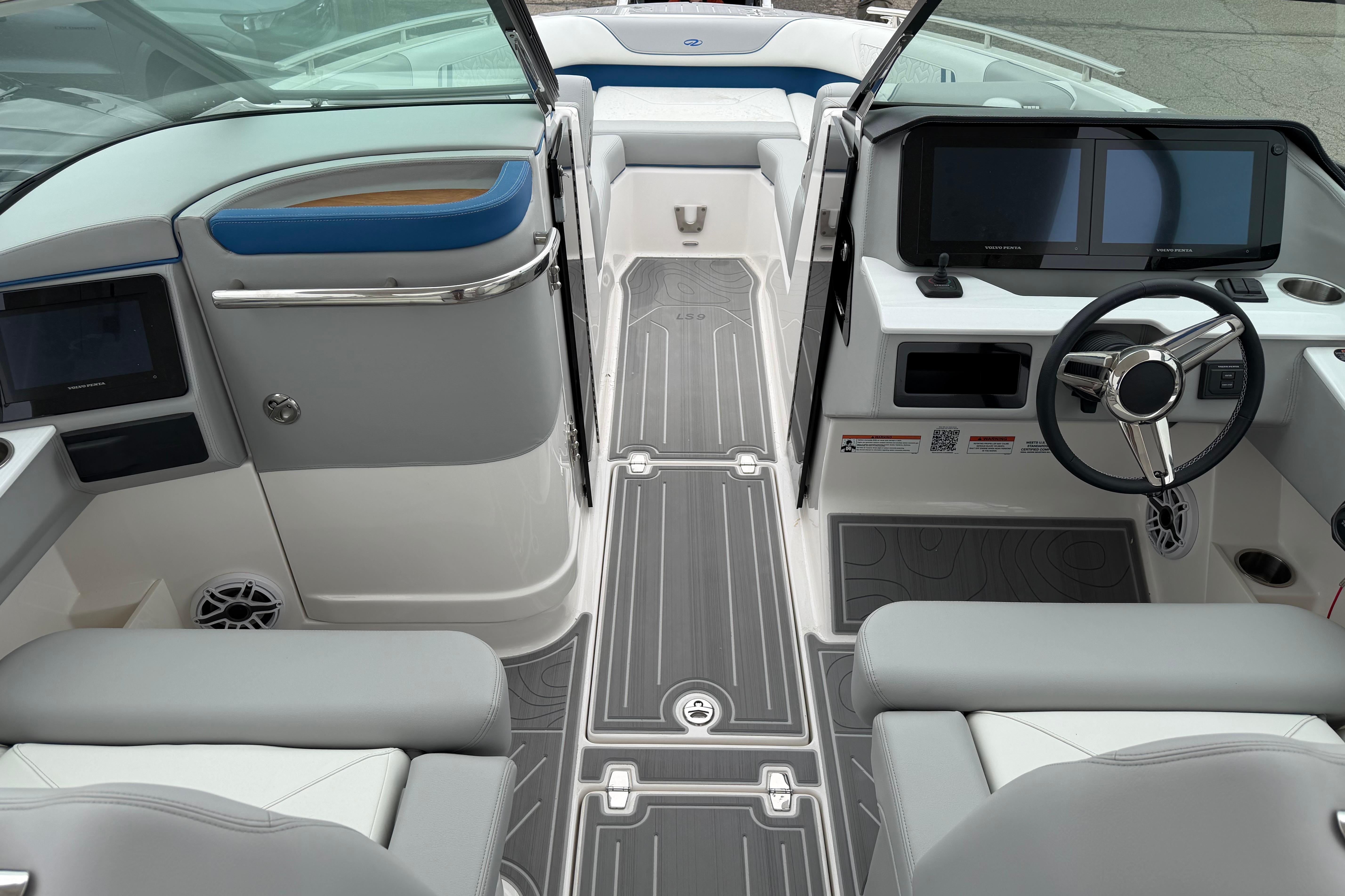 Luxurious interior of 2026 Regal LS9 Surf boat with modern dashboard and seating.