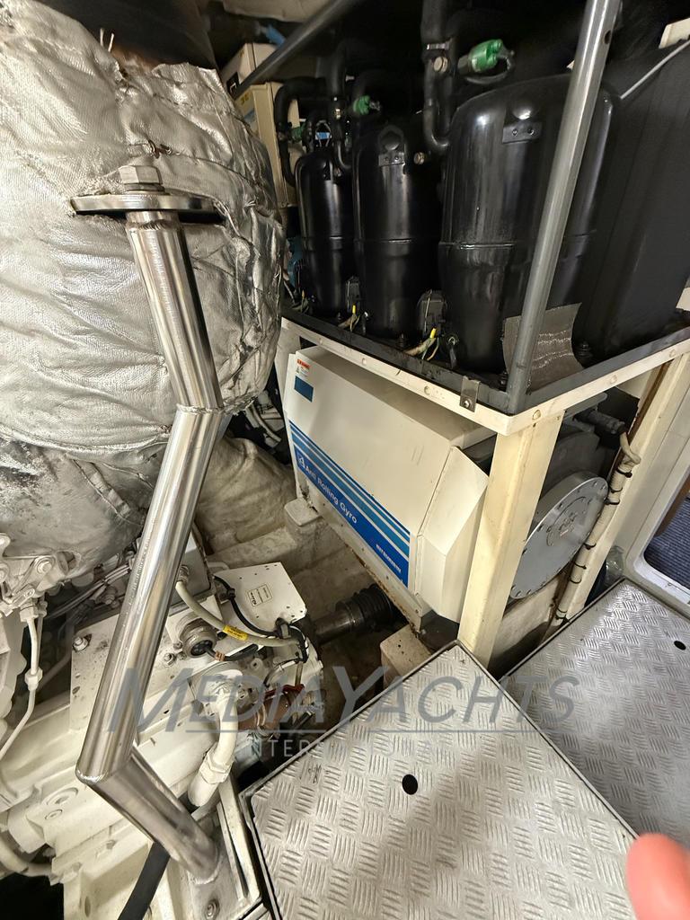Engine room of 2007 Riva Venere 75 yacht, showcasing mechanical components and equipment.