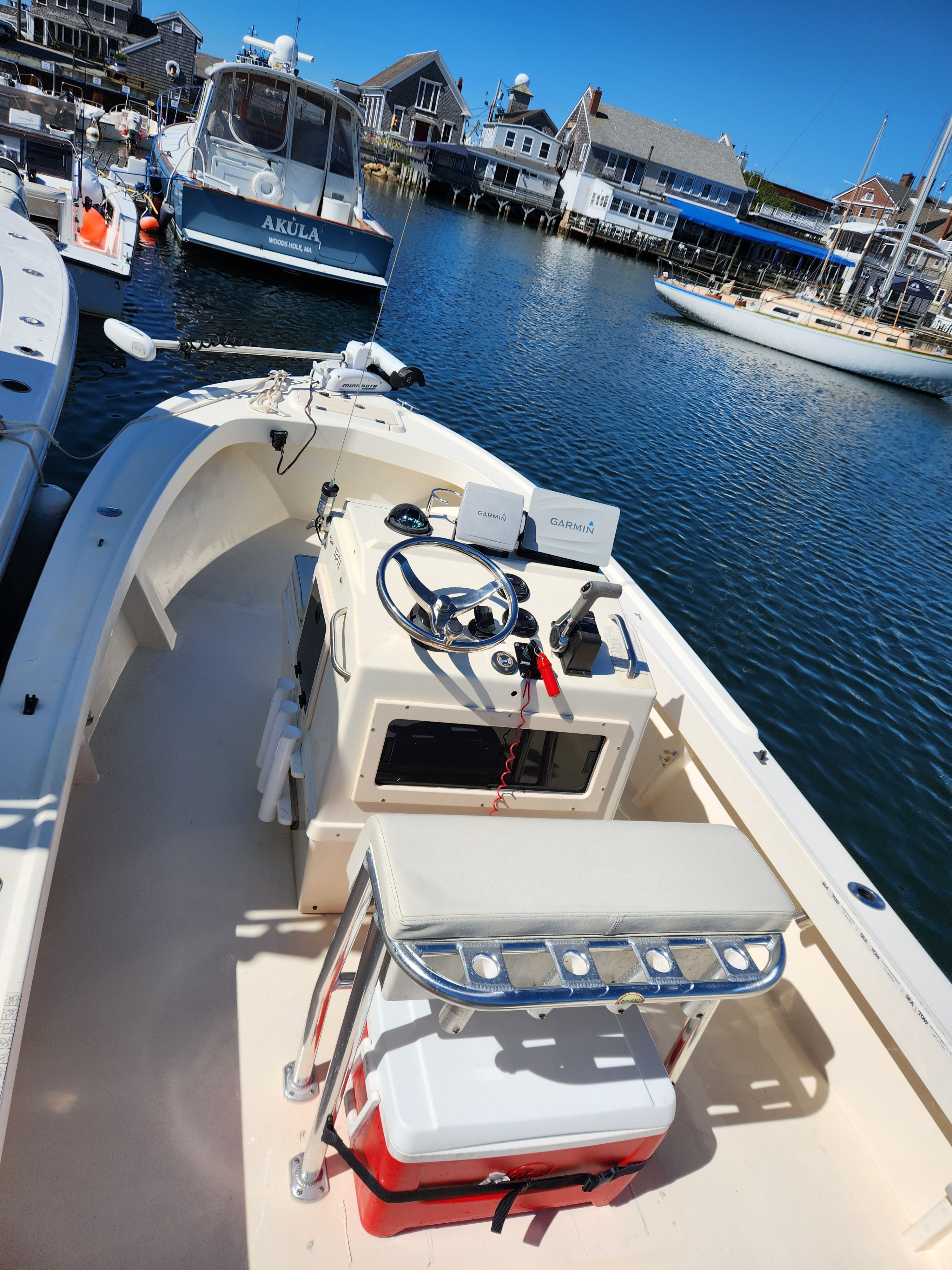 A 2004 Parker 1801 Center Console boat docked in a calm harbor.