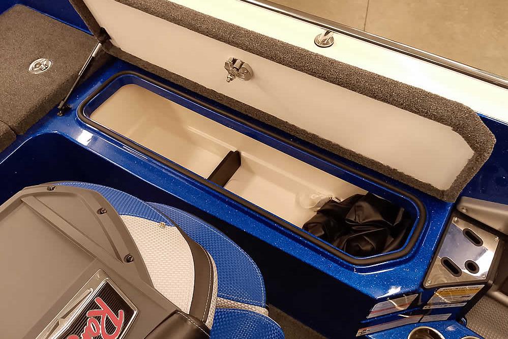 2026 Ranger 620FS Cup-Equipped boat interior storage compartment, open lid, blue finish.