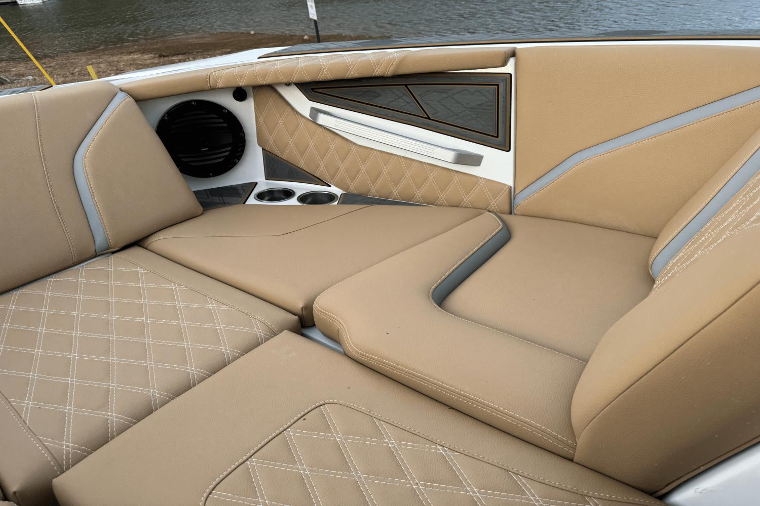 2024 Tigé RZX22 boat interior with tan leather seats and diamond stitching.