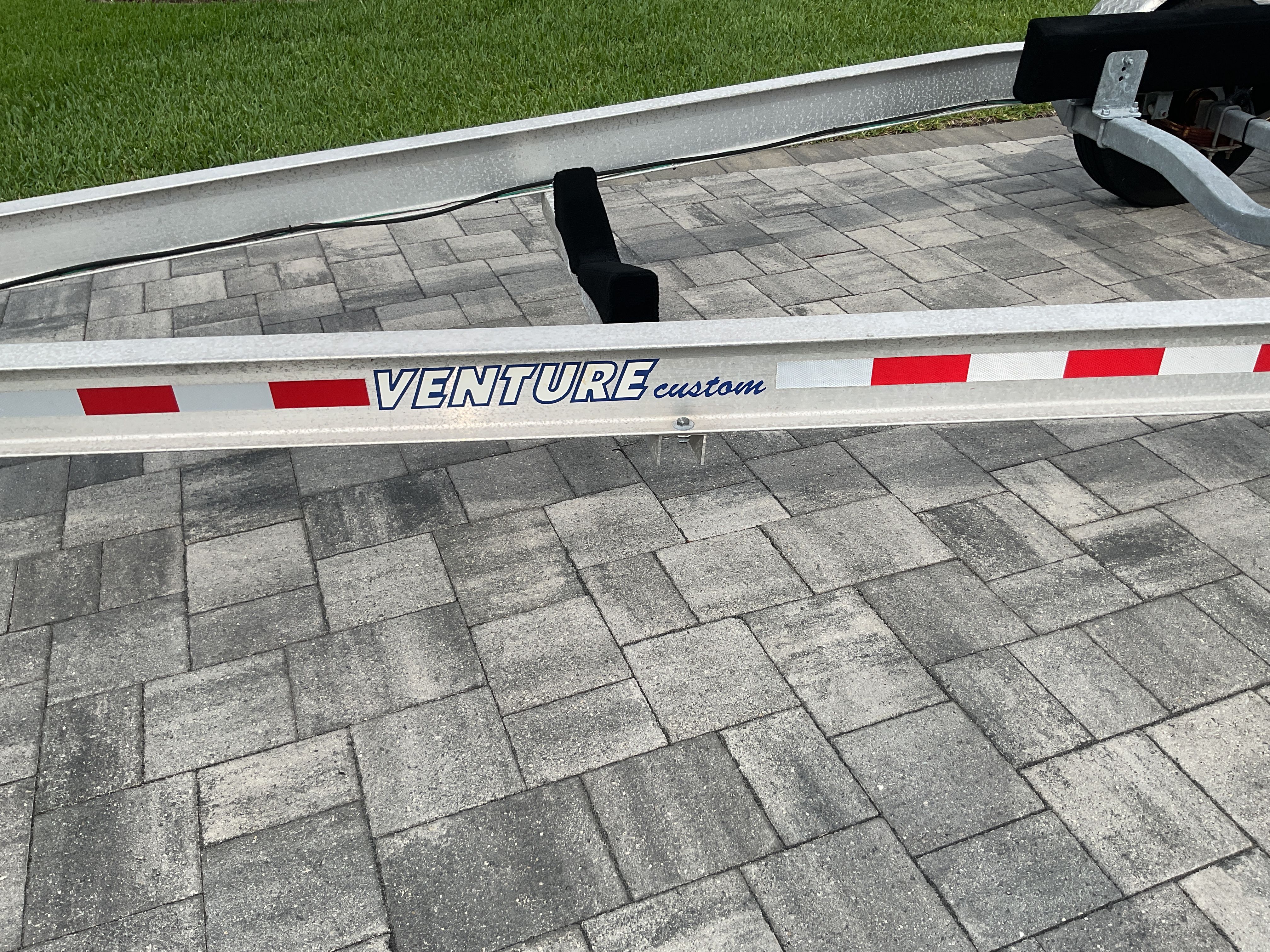 Venture Custom boat trailer on paved ground, 1997 Eastern 27 Lobster Fisherman.