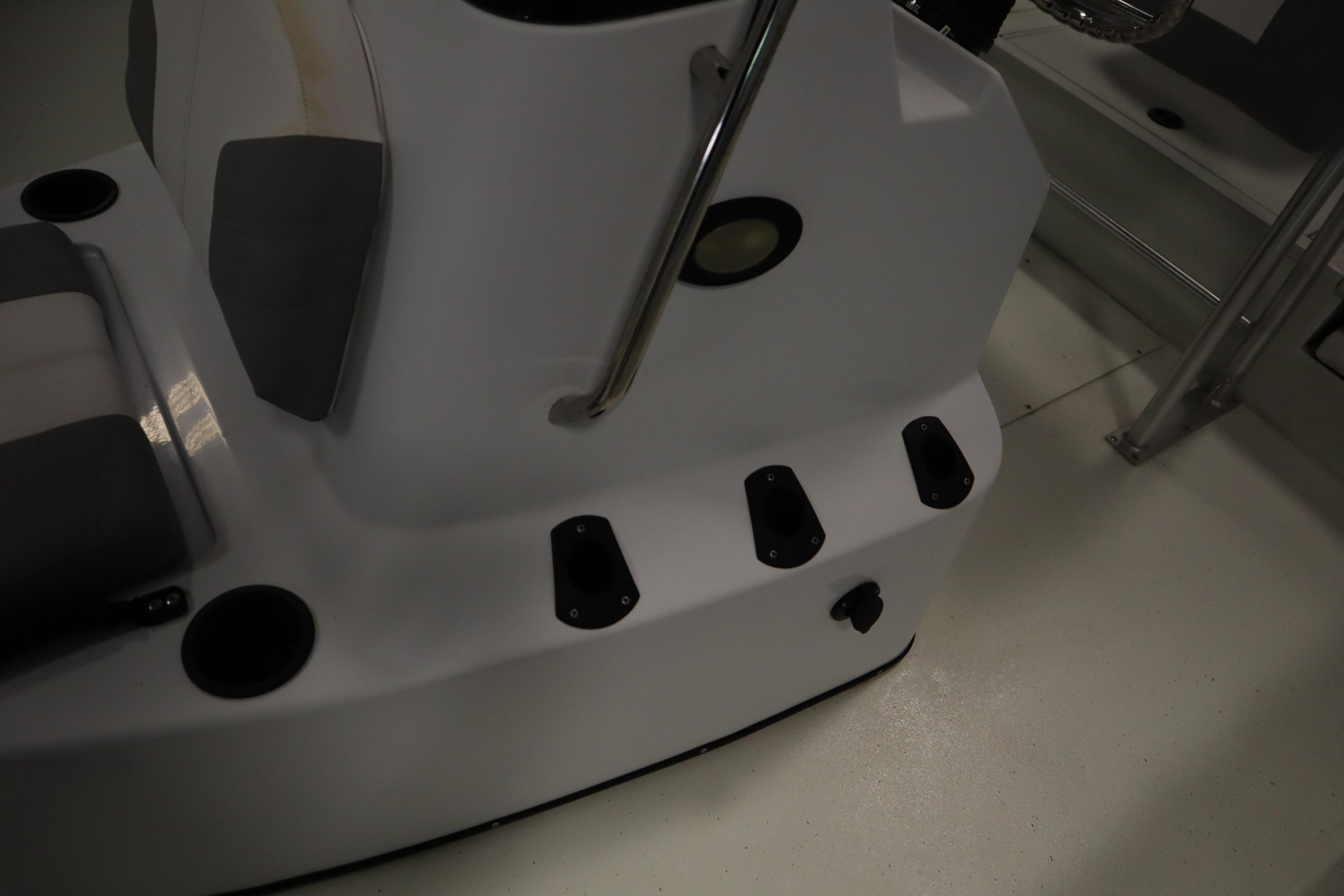 2022 Crestliner 2200 CC boat interior with seating and cup holders.