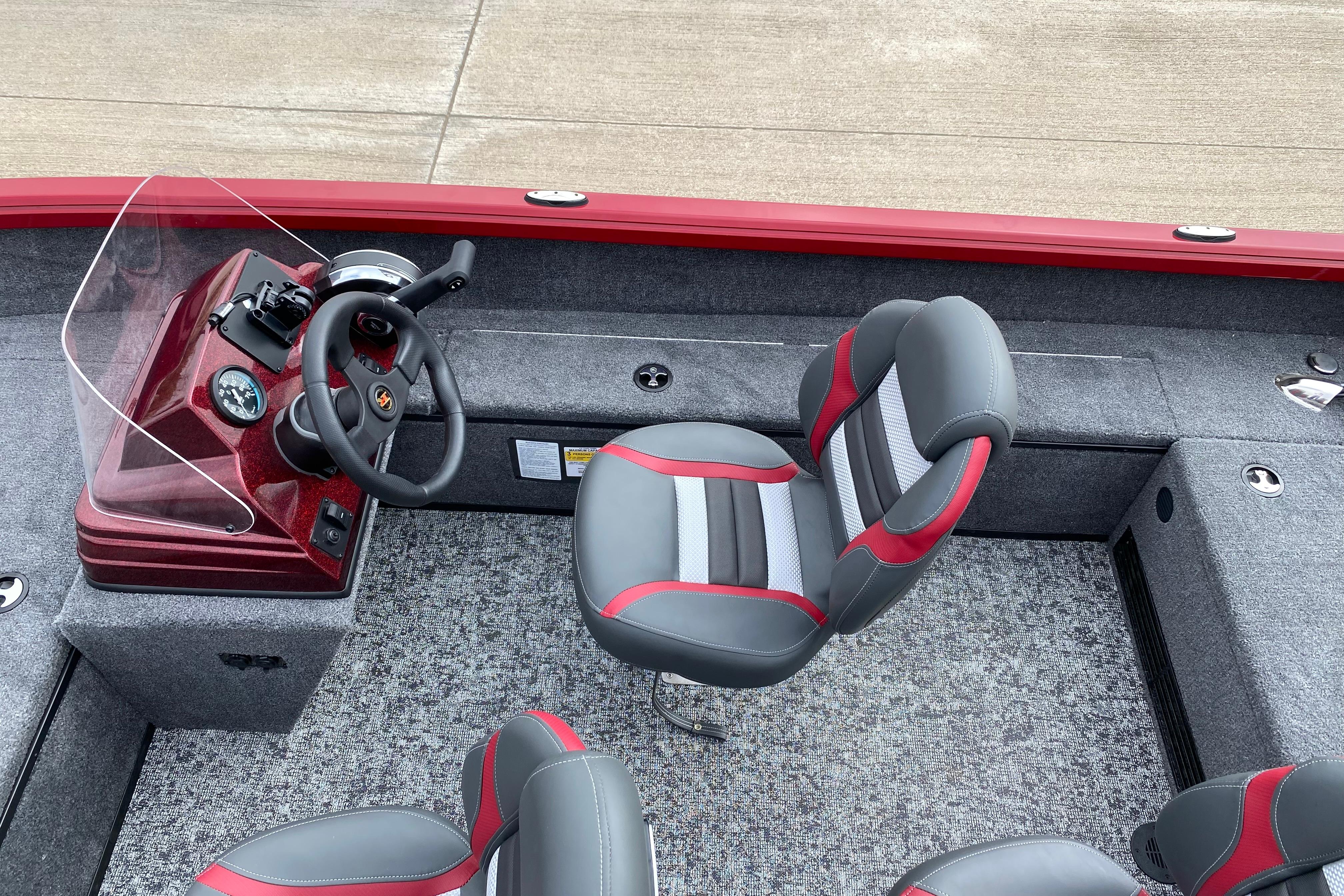 2026 Ranger VS1665SC boat interior with steering console and cushioned seats.