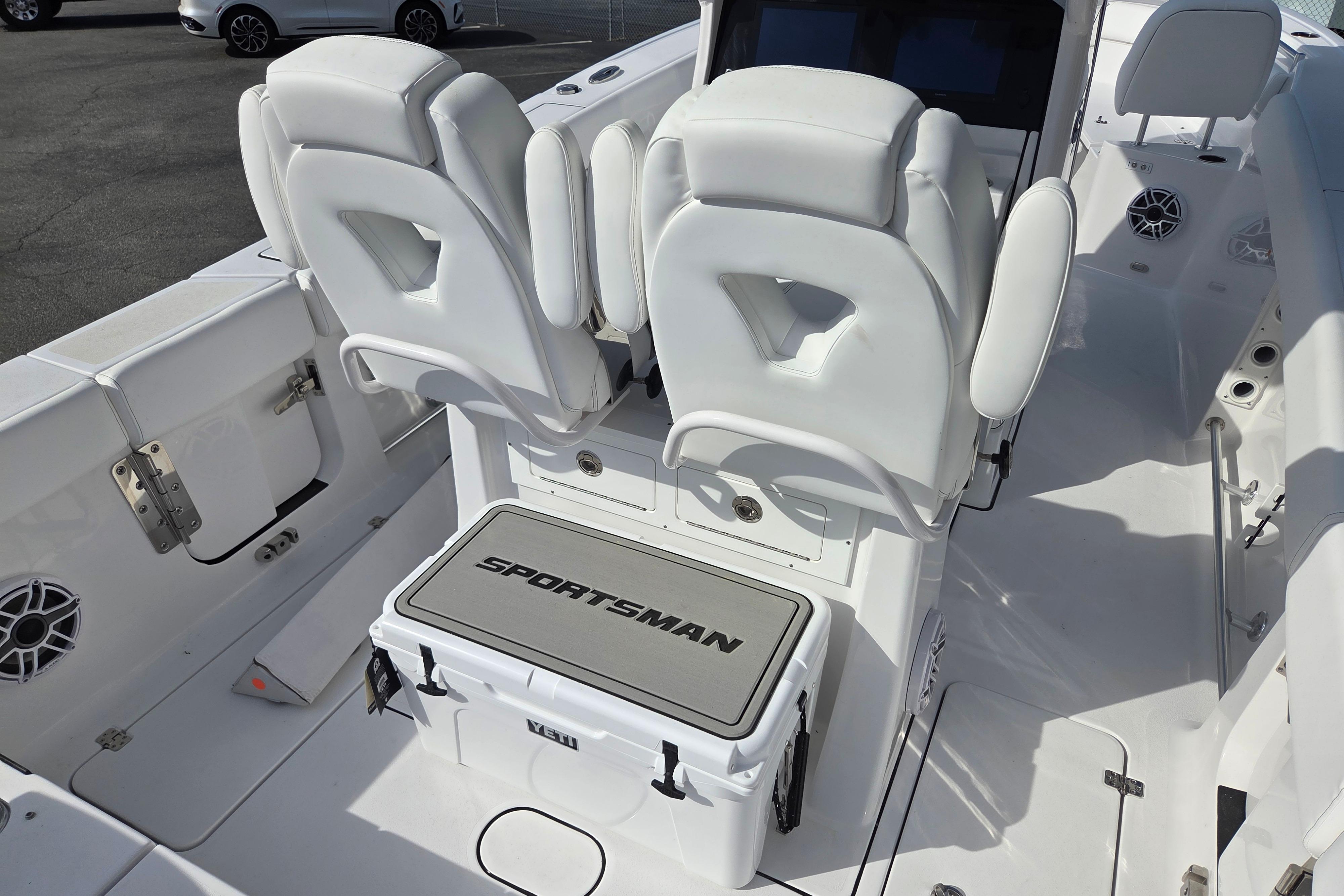 2026 Sportsman Heritage 261 Center Console boat interior with white seating and storage.