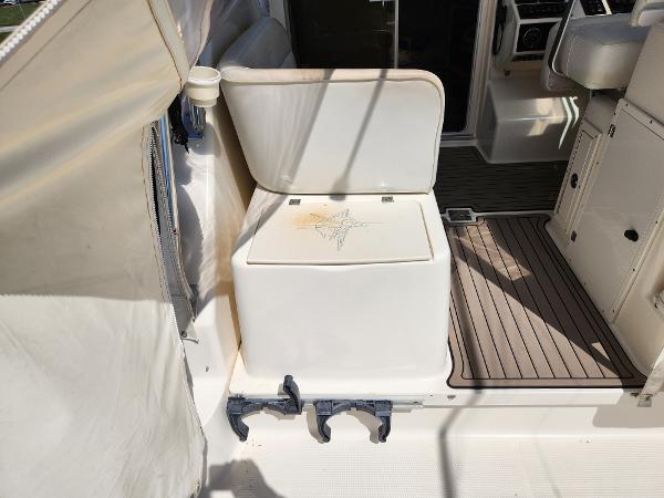 2005 Pursuit 3070 Offshore Center Console interior with seating and storage.