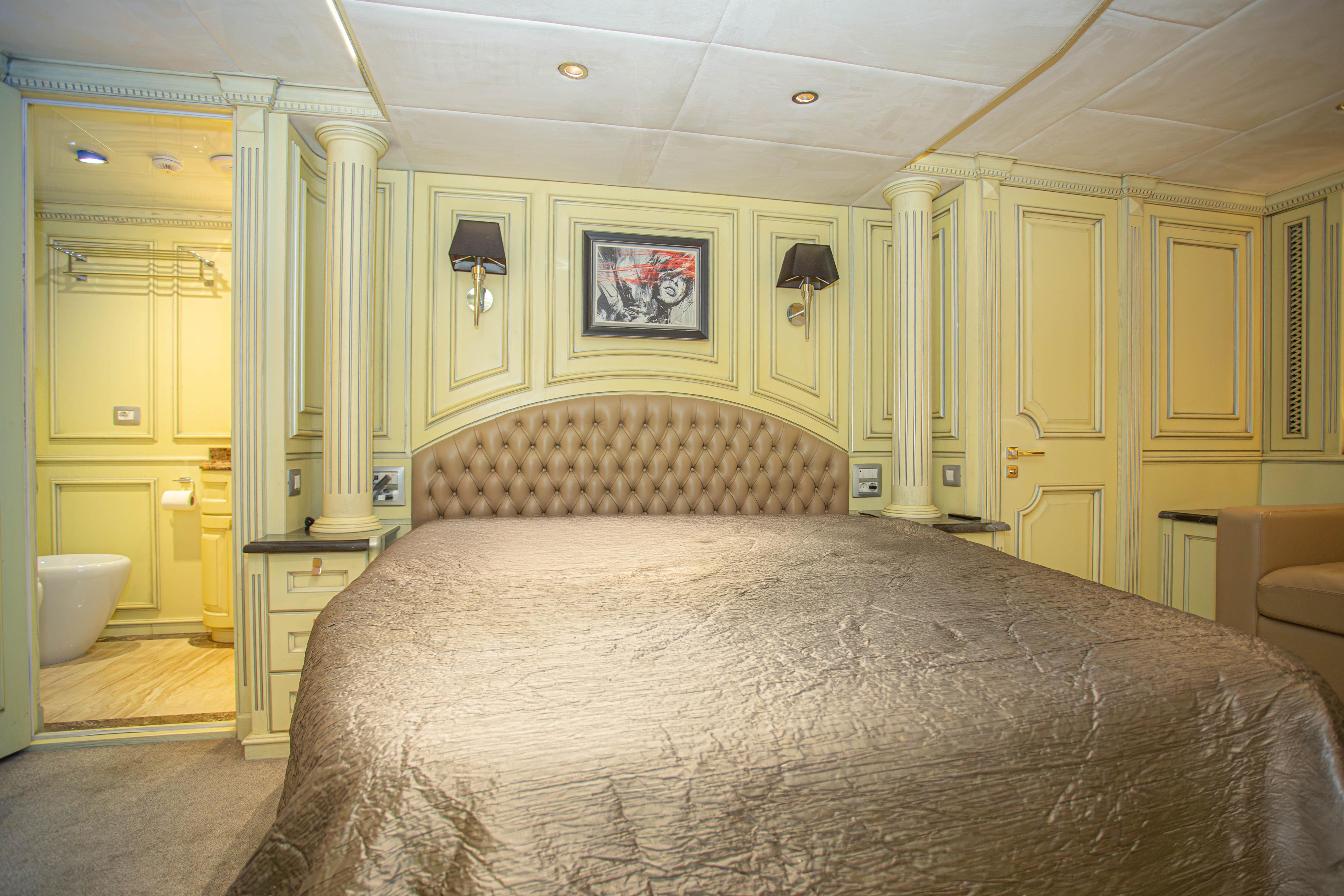 Luxurious bedroom interior on 2014 Fifth Ocean Yachts 24m Displacement Explorer Yacht.