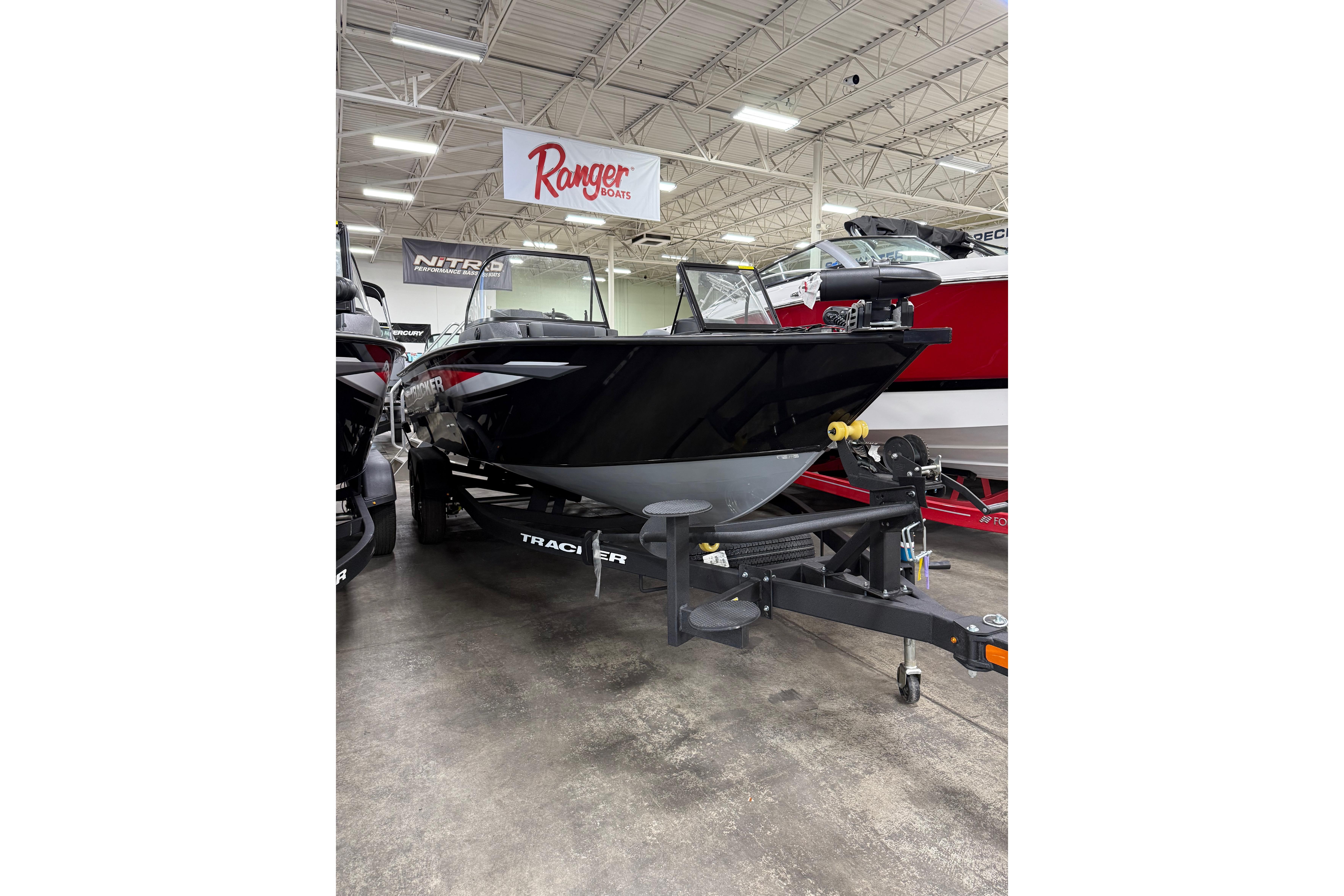 2026 Tracker Targa V-19 WT boat displayed indoors on a trailer.