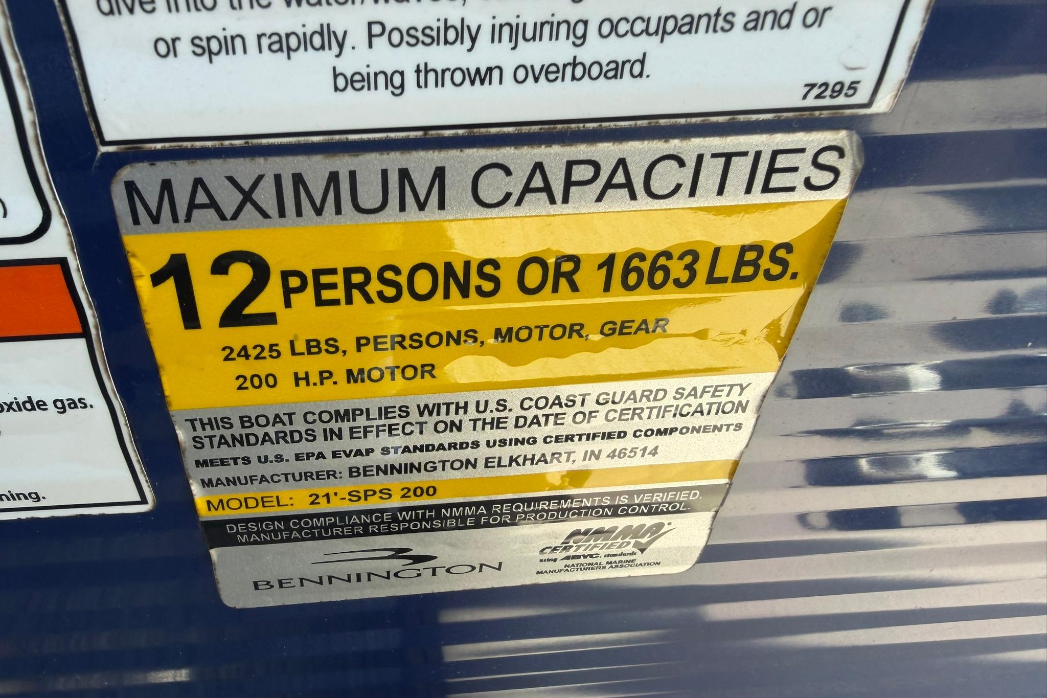 Maximum capacity label on 2020 Bennington SX 22 SFX boat, 12 persons or 1663 lbs.