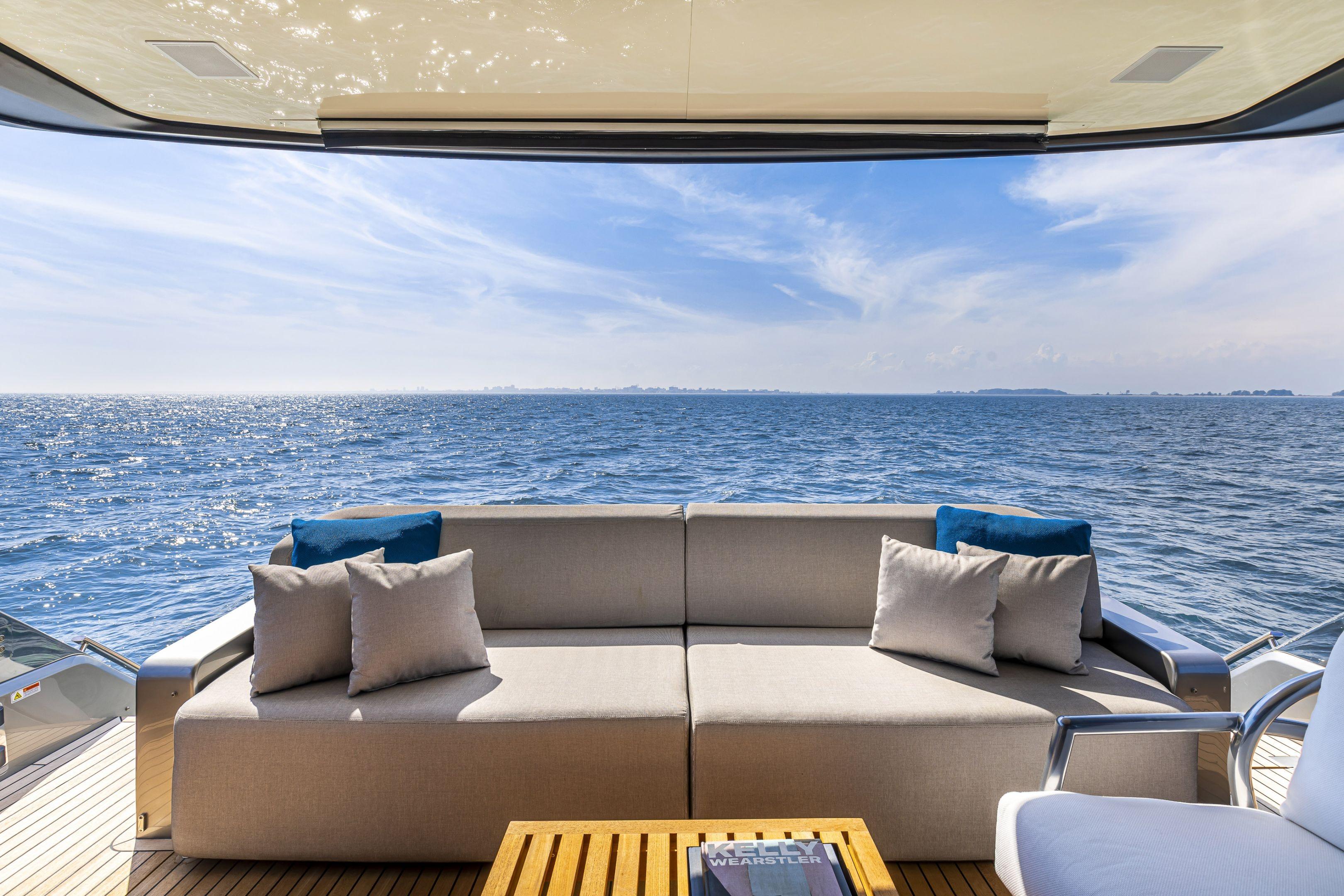 Luxurious Cranchi Sessantasette 67 yacht deck with ocean view, featuring comfortable seating, 2026 model.