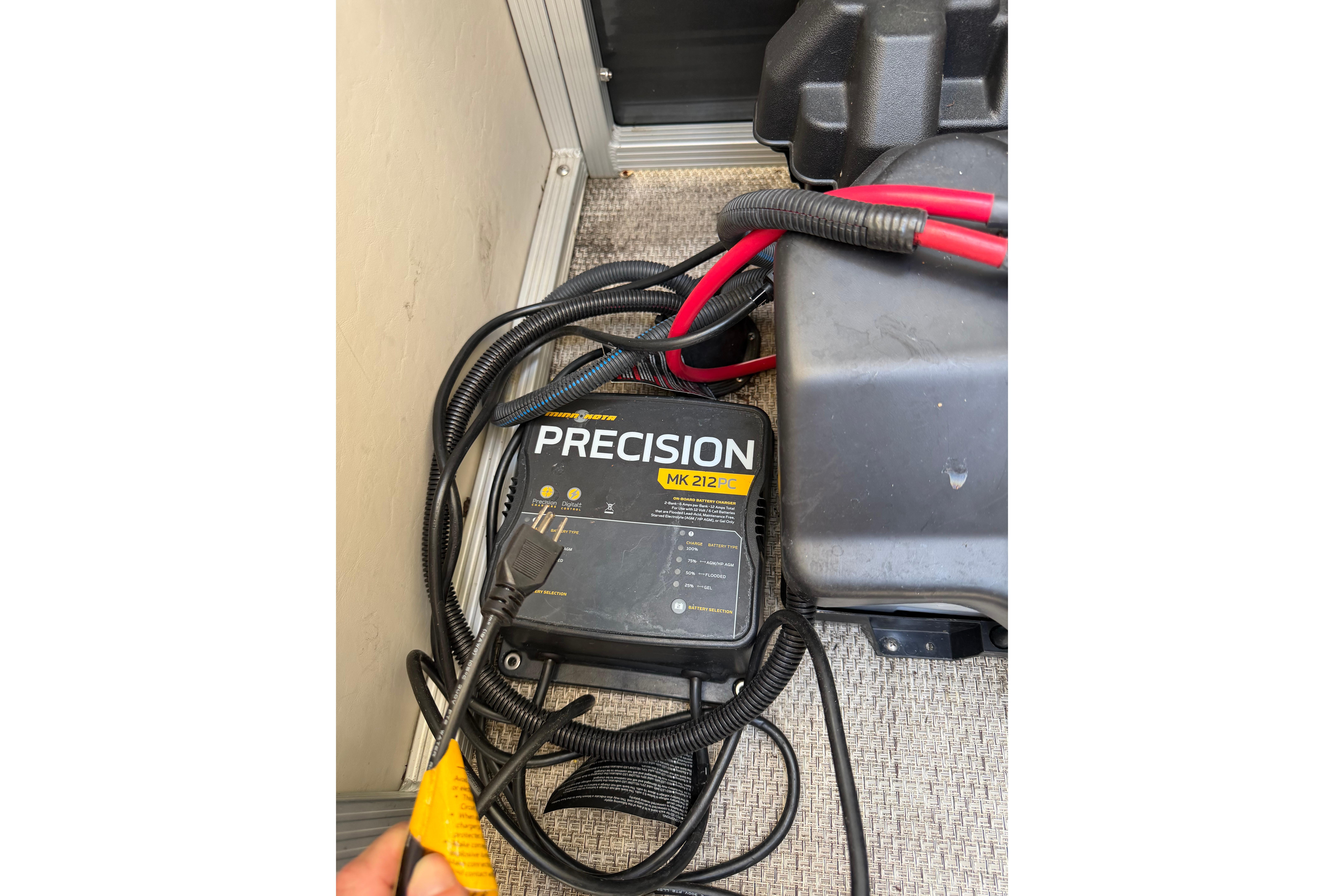 Battery charger and cables on a 2018 Bennington 21 SF boat.
